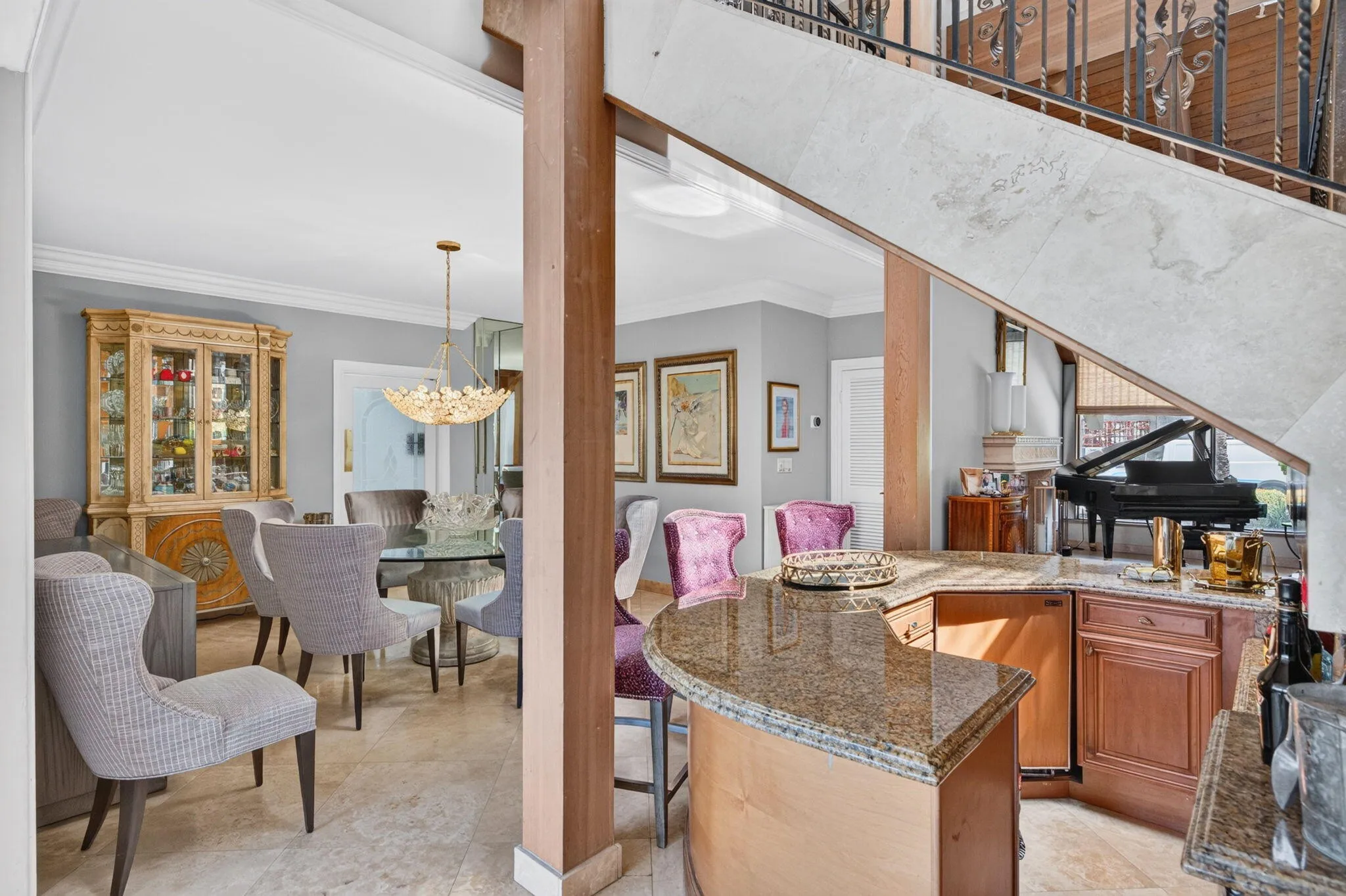 The dining area flows easily toward the bar and main living spaces, creating a practical layout for entertaining.