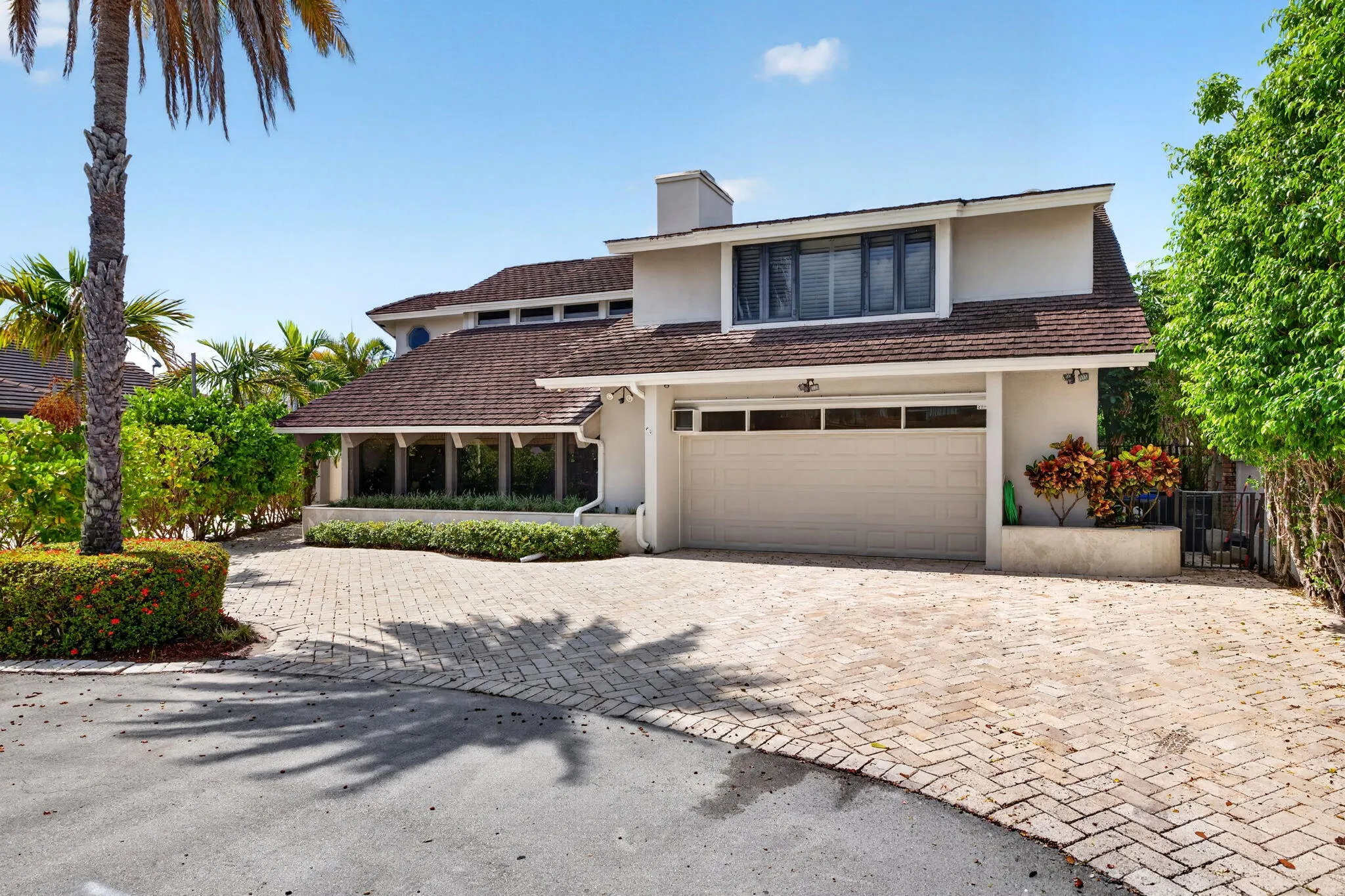 The front approach introduces the residence with strong curb appeal and a gracious arrival sequence.