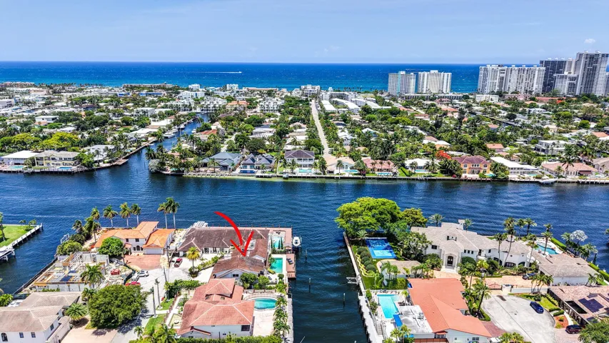 The aerial context highlights the home’s proximity to the ocean, waterways, and surrounding Fort Lauderdale coastline.