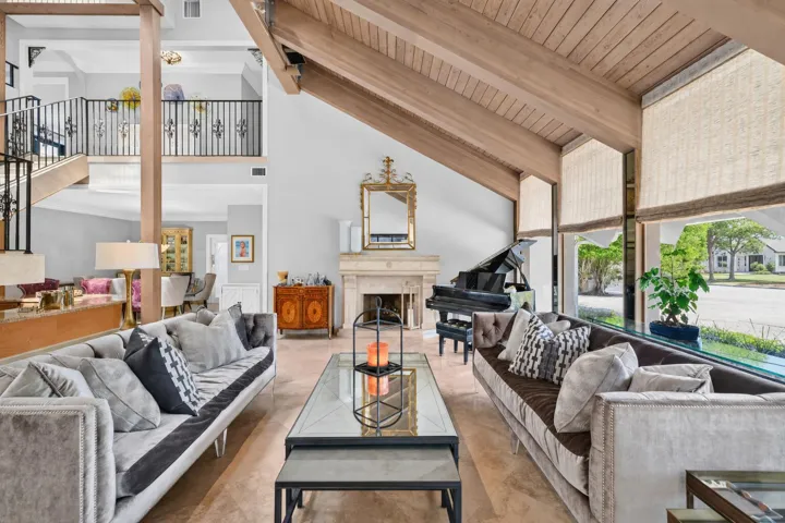 Expansive seating areas frame the home’s vaulted architecture and create a bright, comfortable main living space.