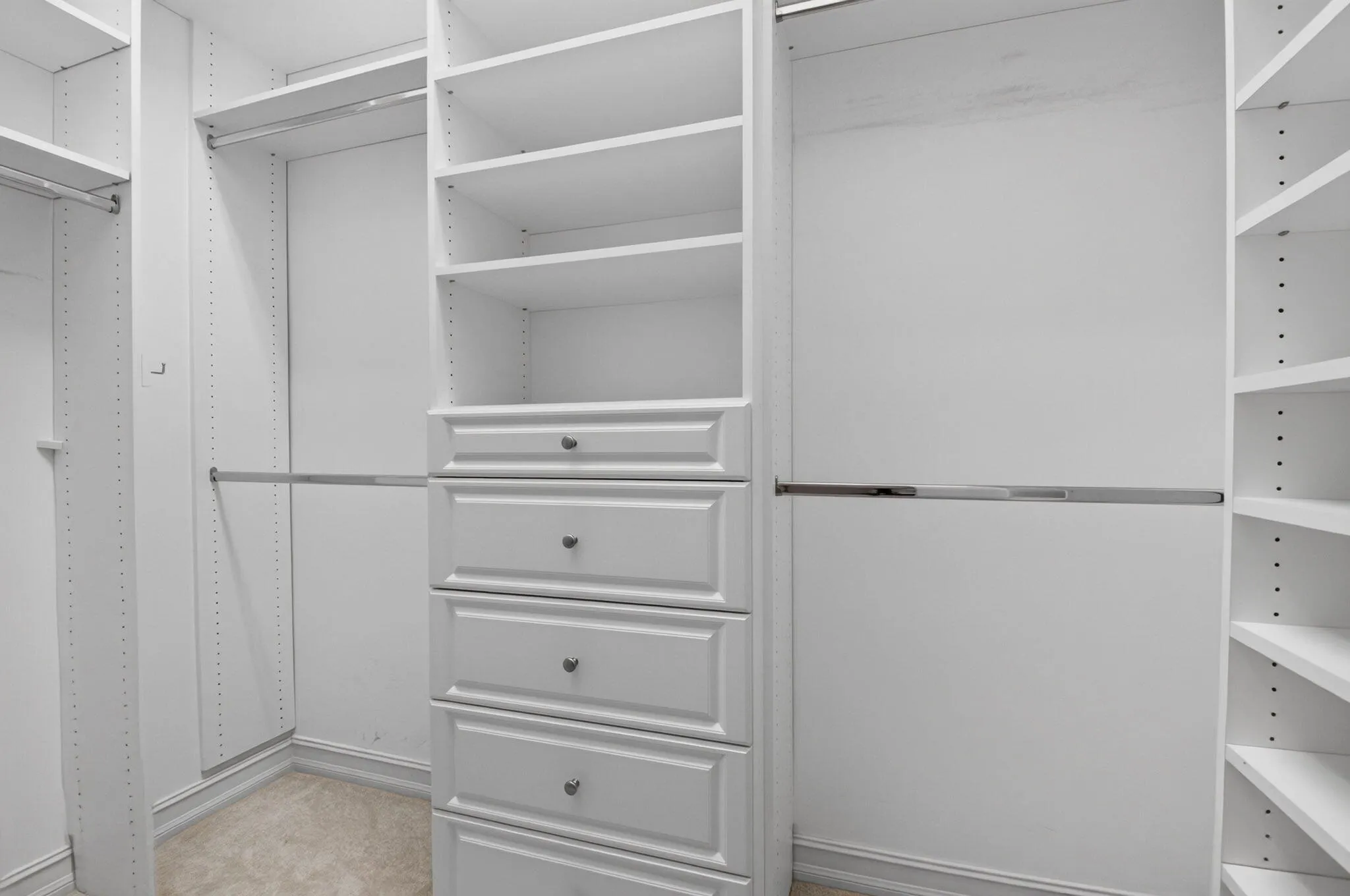 Primary Custom Built Walk-In Closet 1
