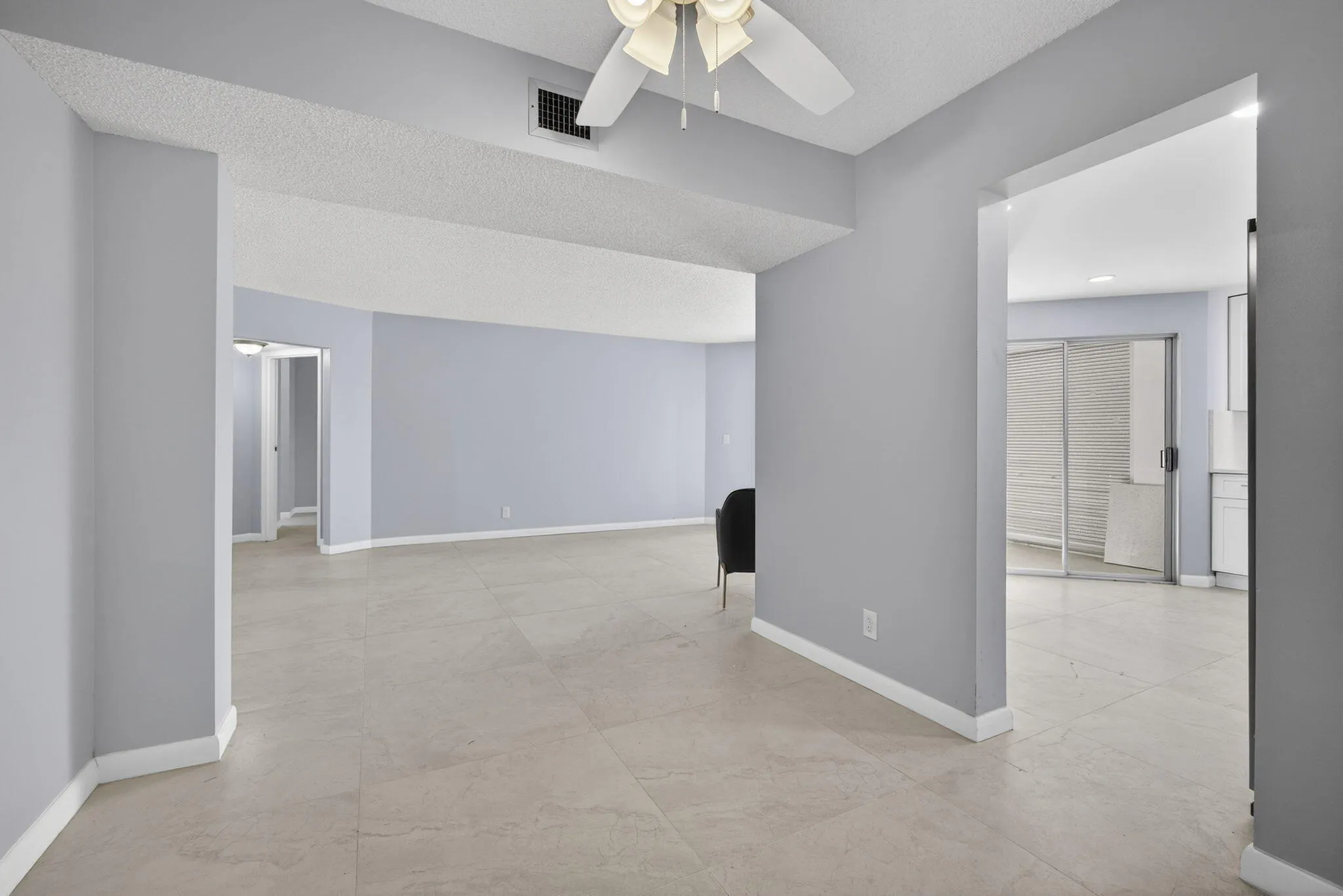 View from dining room area of kitchen and living room