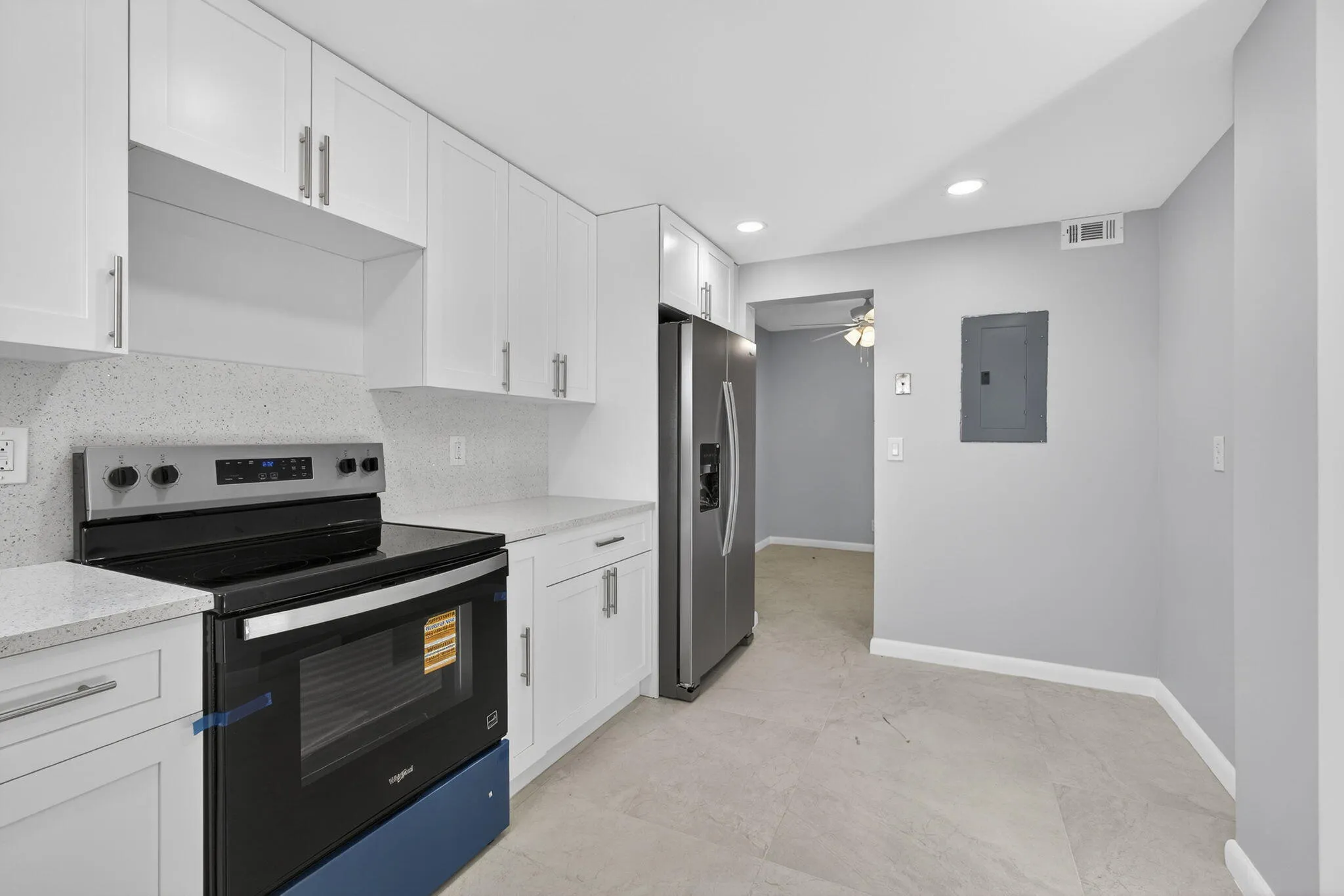 View of kitchen showing new electrical panel