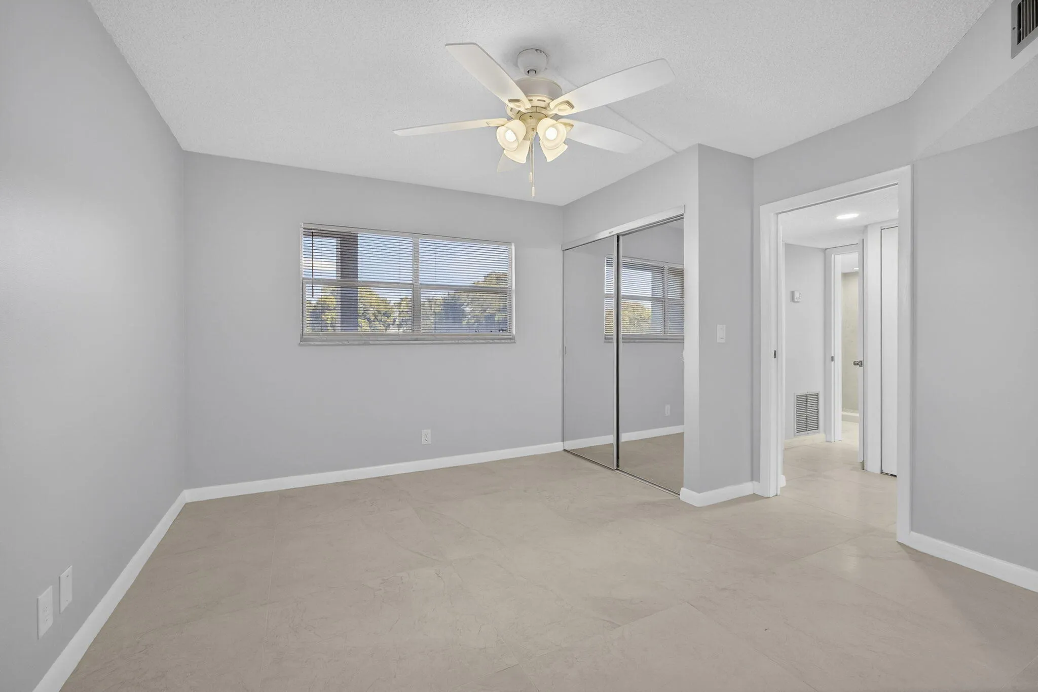 Guest bedroom with new ceiling fan and Italian Tiles