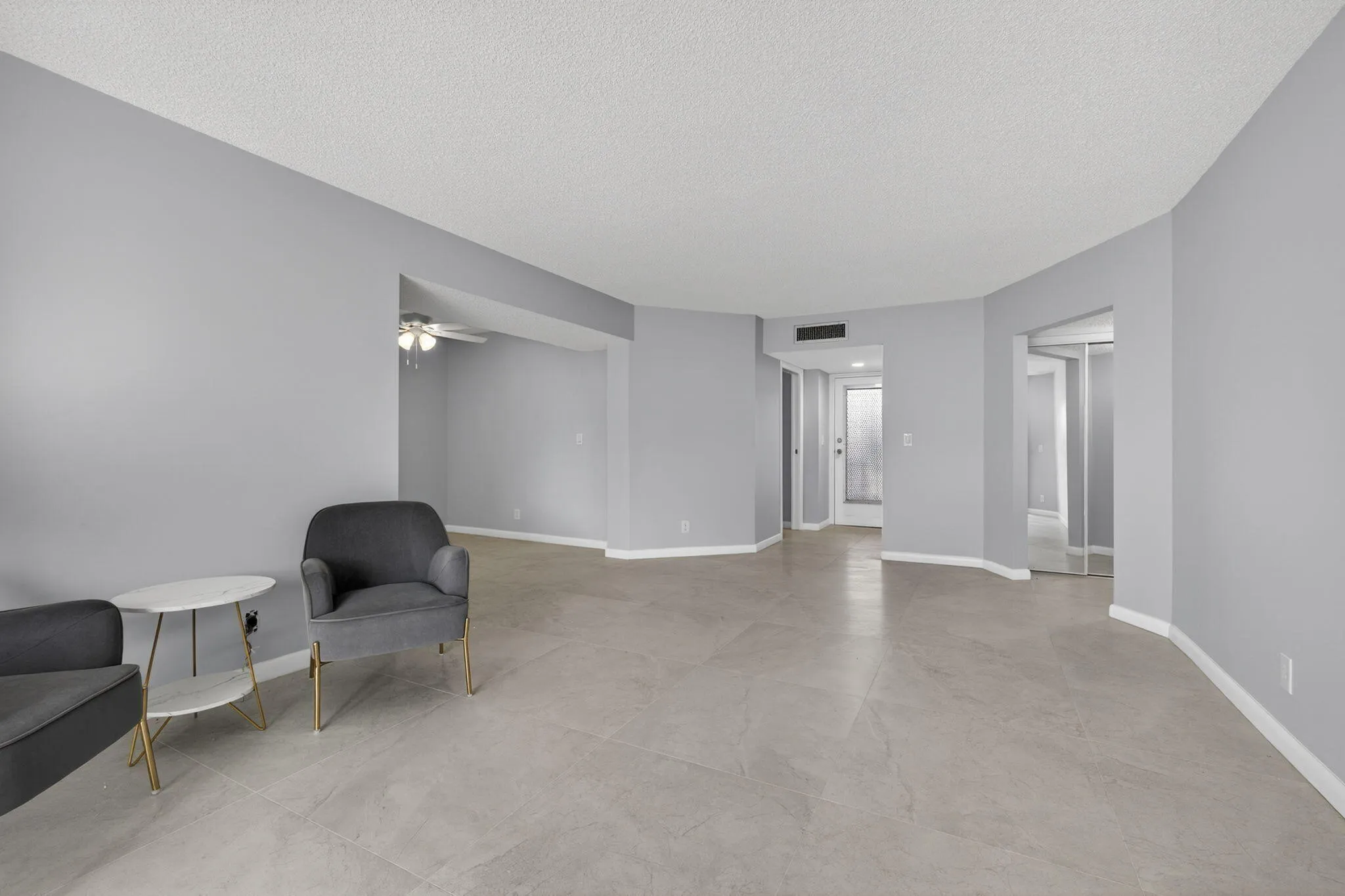 View of living room and dining room area from balcony