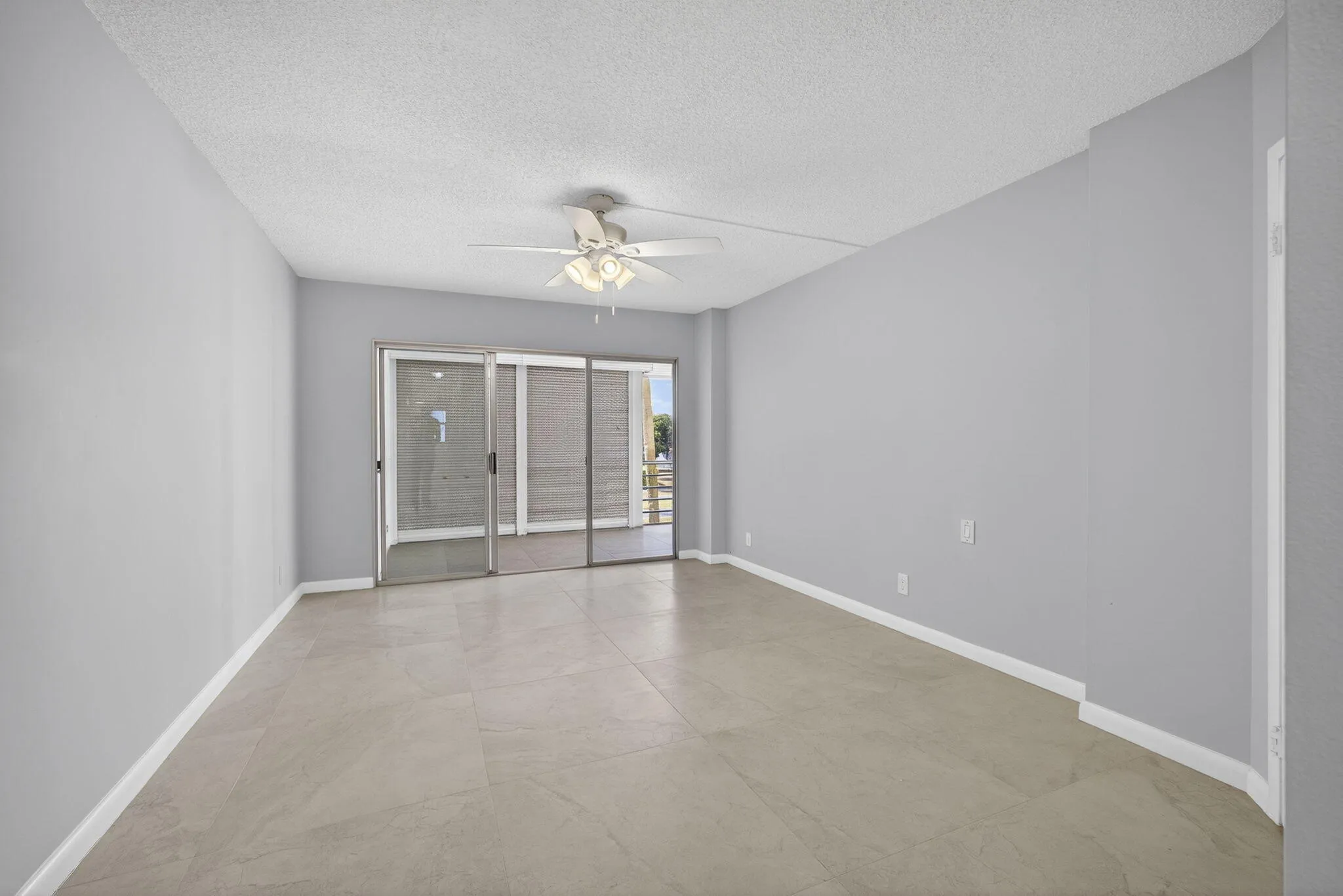 View of balcony from master bedroom showing new fan