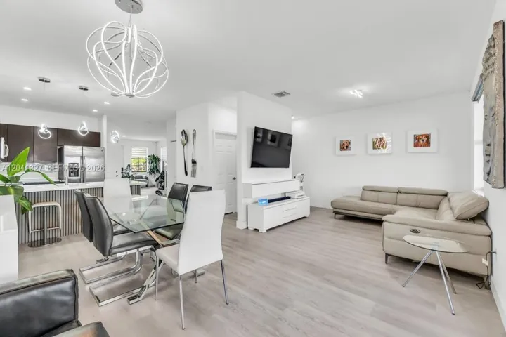view of the dining and bonus space that can be used as a fourth bedroom, family room, office, or guest room.