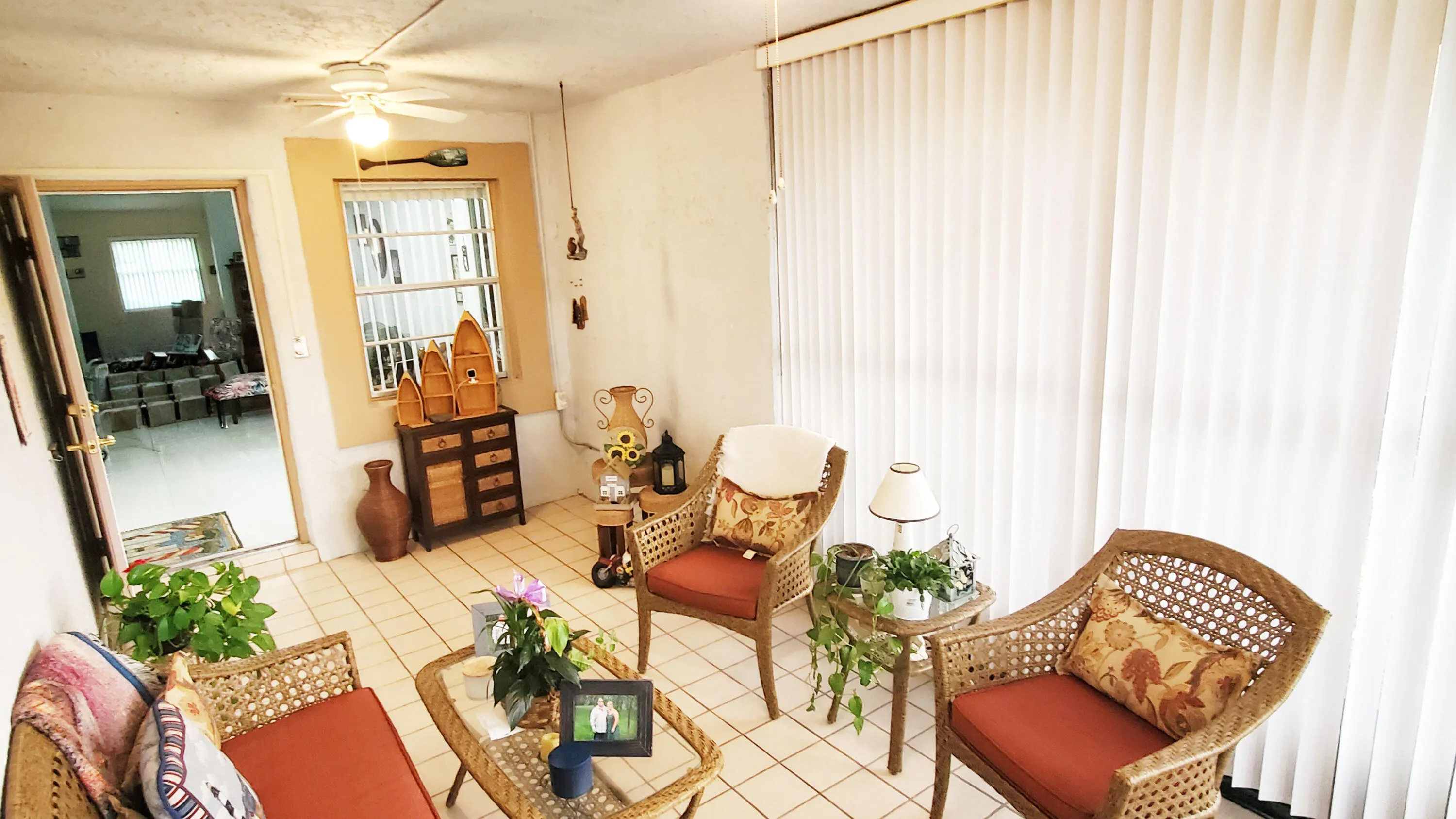 Porch has accordion shutters,