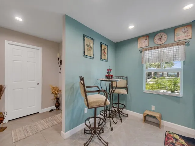 Interior space featuring tiled flooring and a window with natural lighting