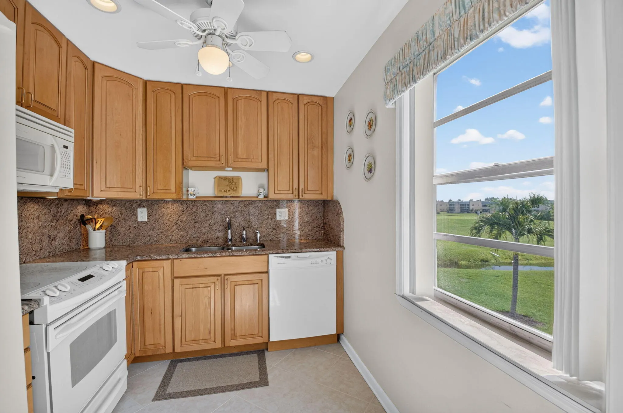 CORNER unit features EXTRA windows! Enjoy the morning sunshine & plenty of natural light with a large kitchen window!
