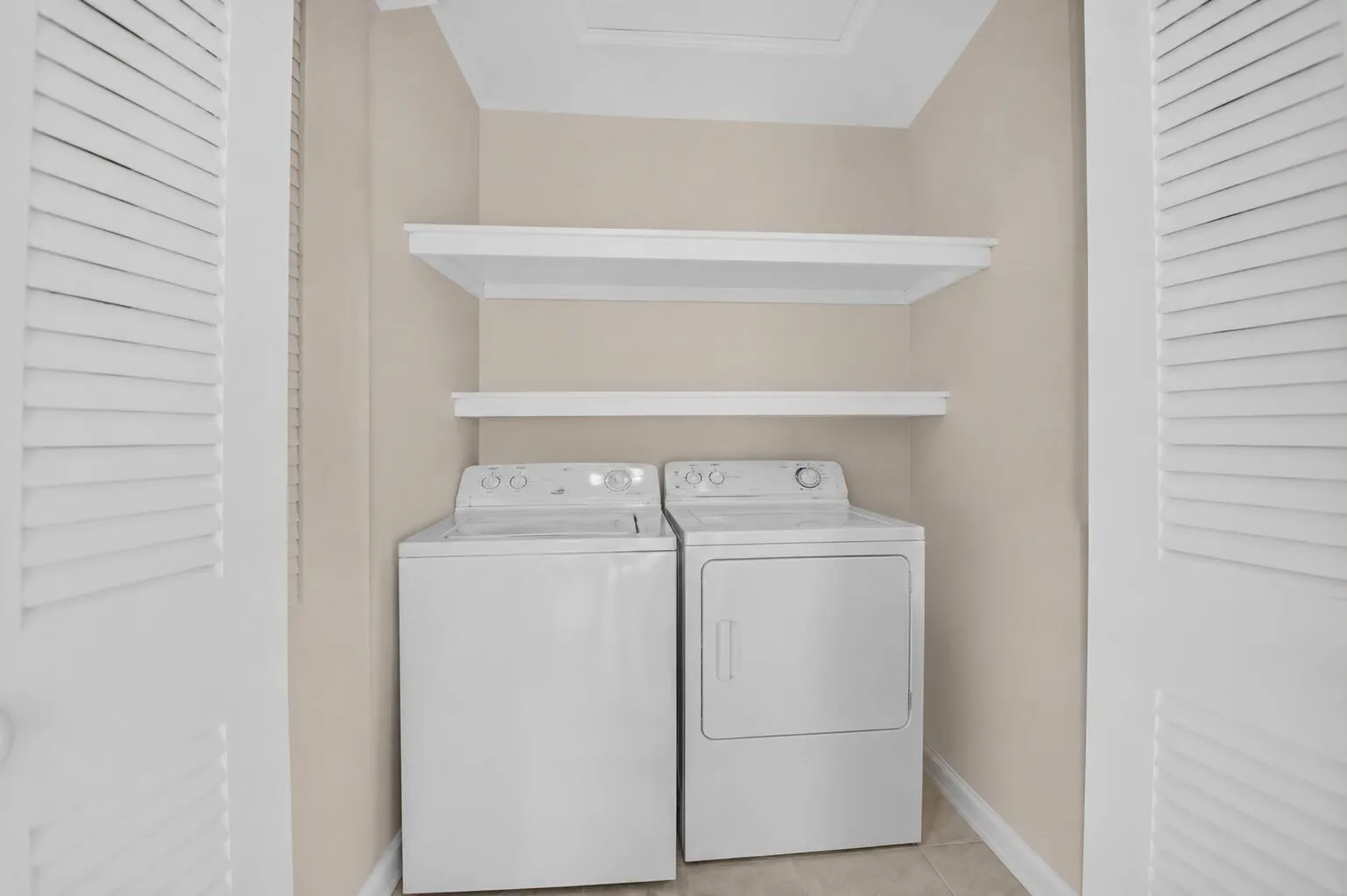 Over sized balcony storage area holds full-sized washer and dryer with plenty of space for all of your laundry needs!