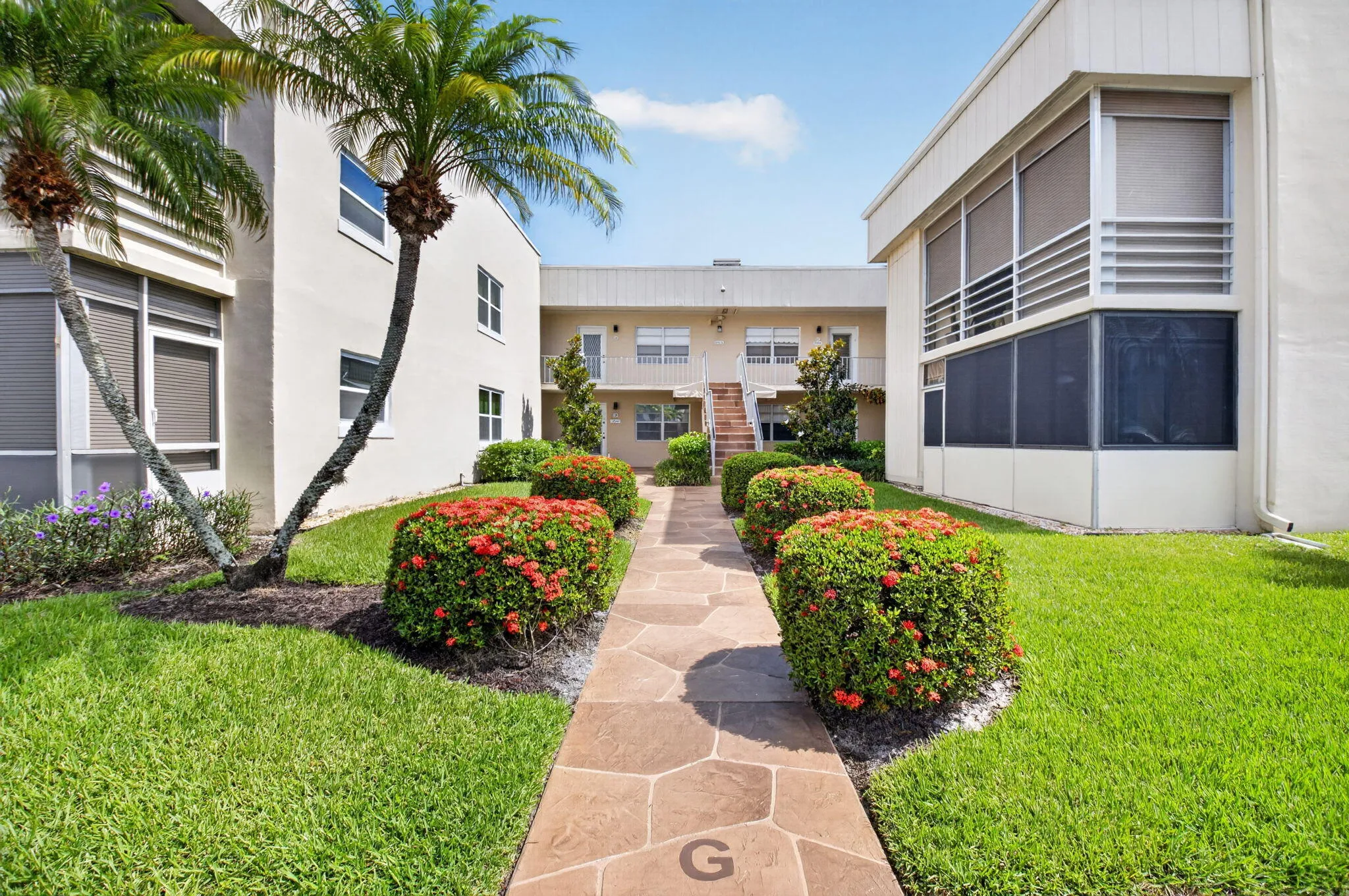 Well maintained exterior walkway provides easy access to stairs or elevator.