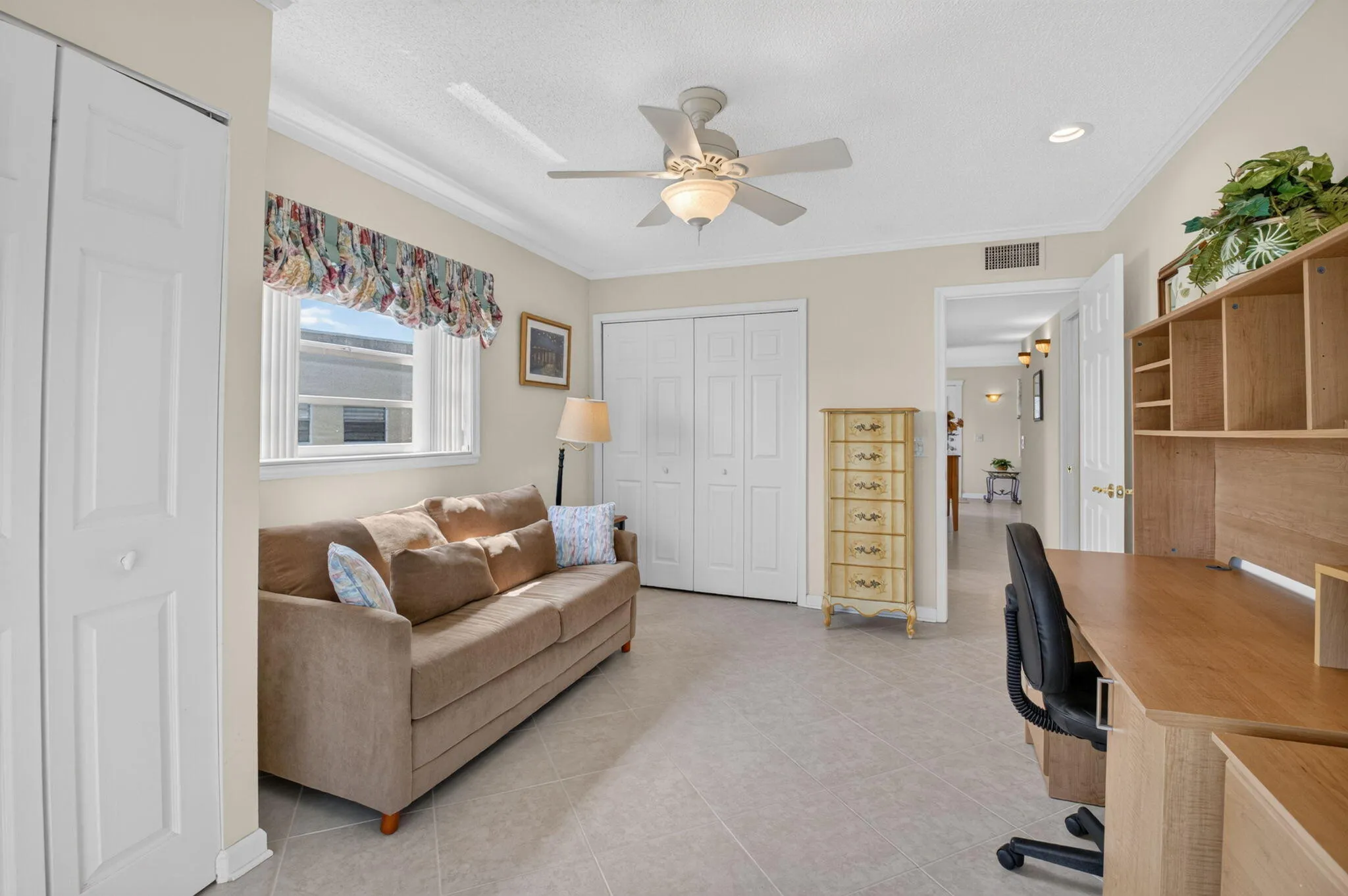 Guest bedroom with 2 closets and views of the golf course and lake!