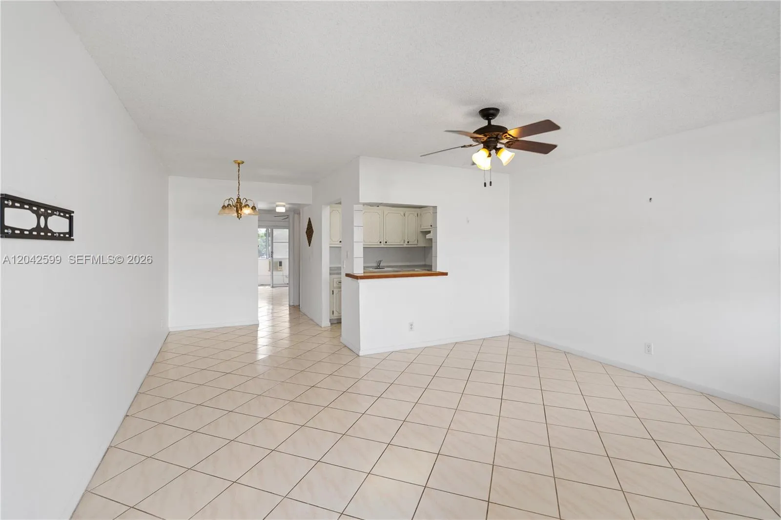 Inviting tiled entryway with ceiling fan for year-round comfort