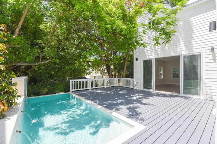 Mature tropical landscaping for added privacy.