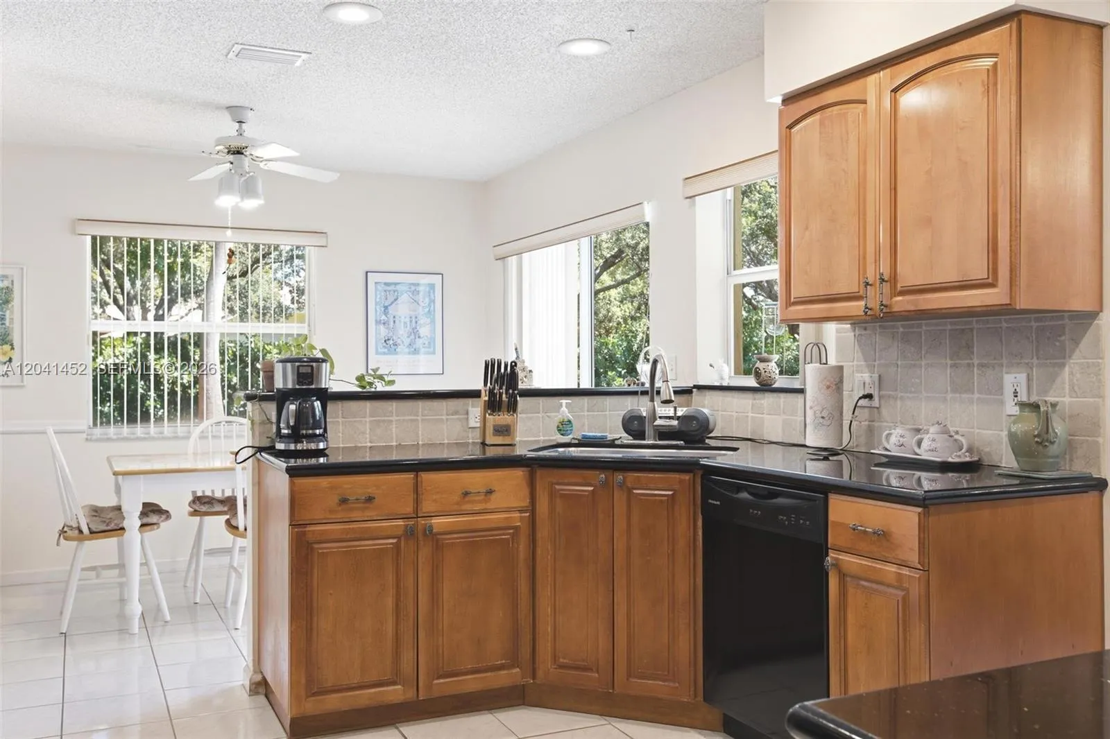 Tumble stone backsplash accents the granite counter tops!