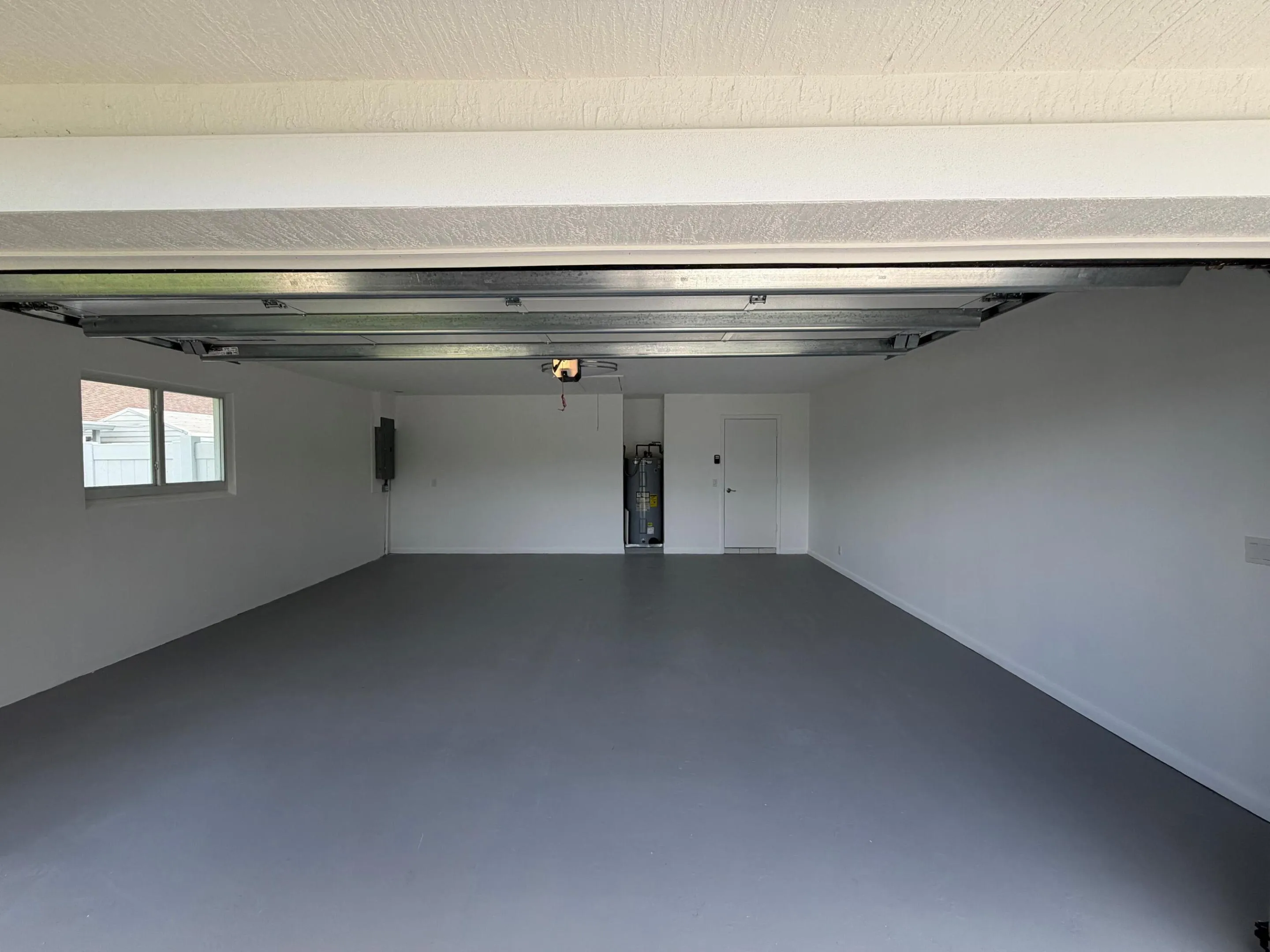 Two car garage with overhead hurricane garage door installed 2026, Upgraded Electrical panel installed 2025.