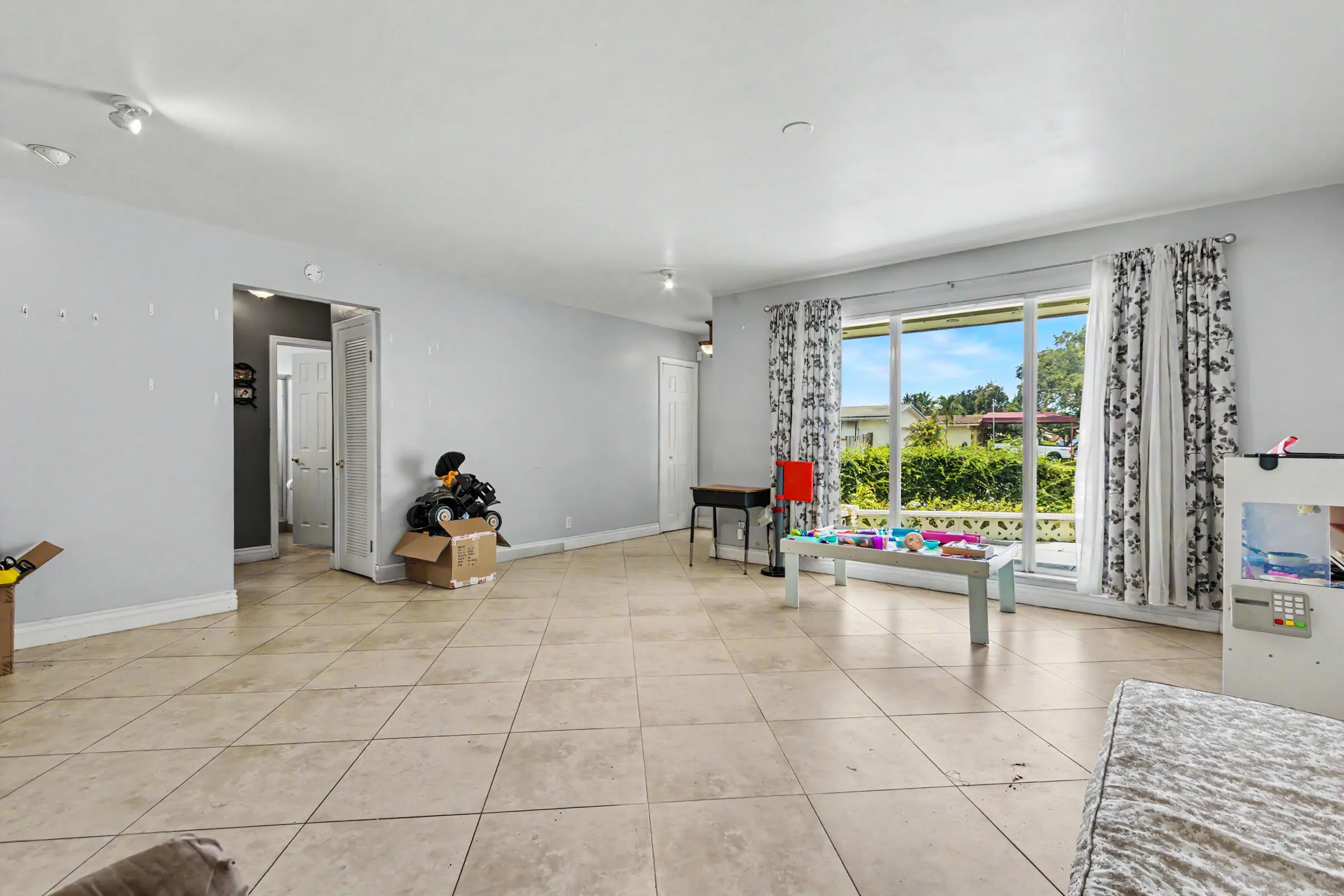Enormous ling area with floor to ceiling impact rated windows