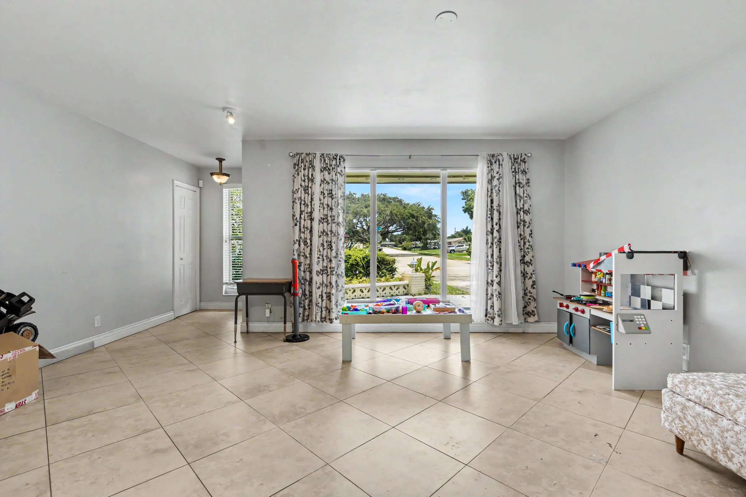 Enormous ling area with floor to ceiling impact rated windows