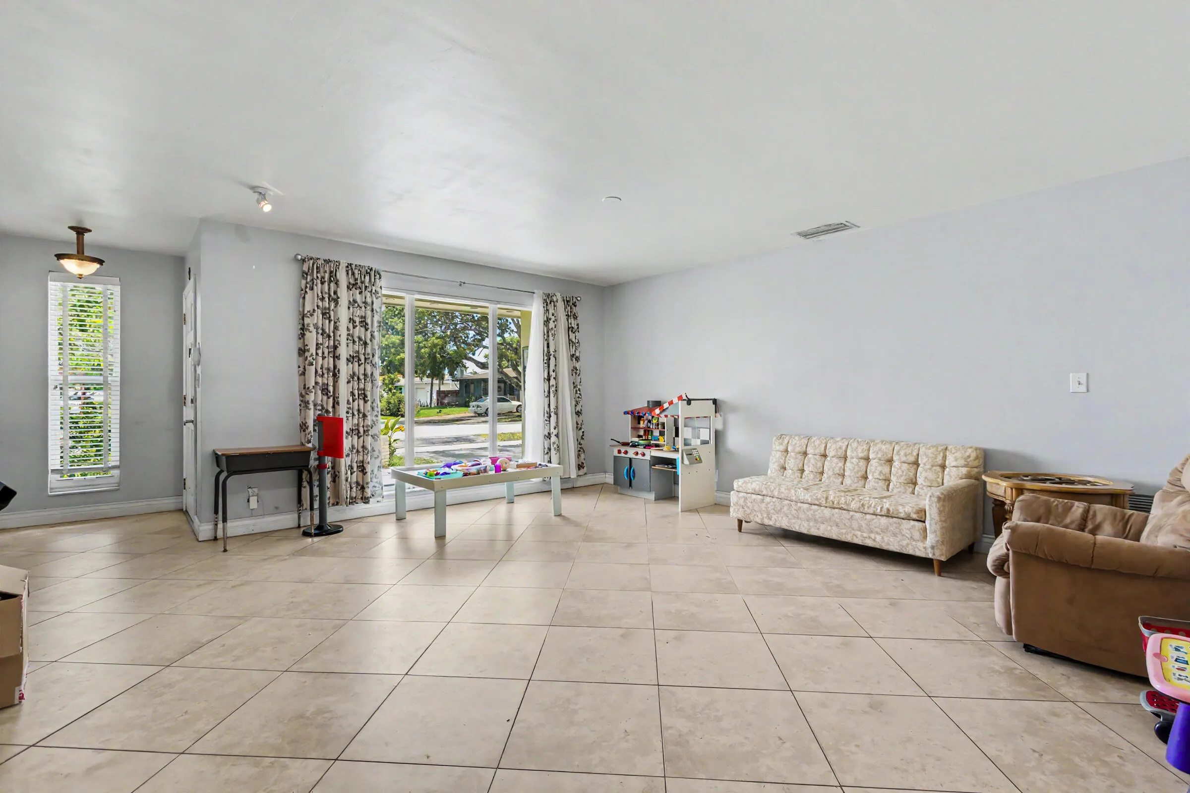 Enormous ling area with floor to ceiling impact rated windows