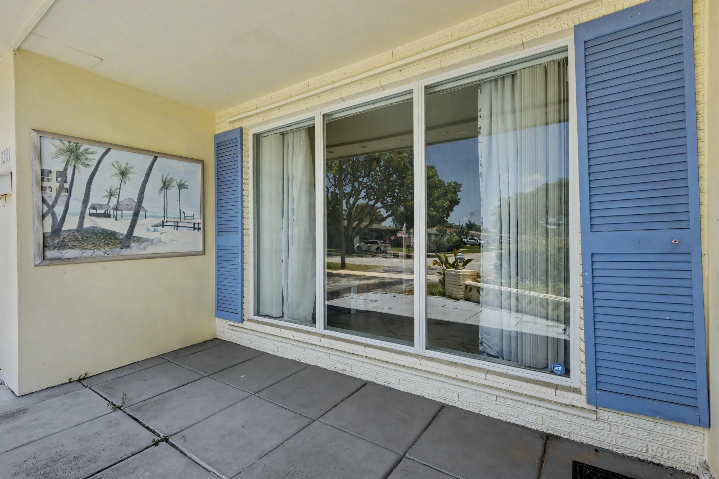 Large covered entryway with Impact windows