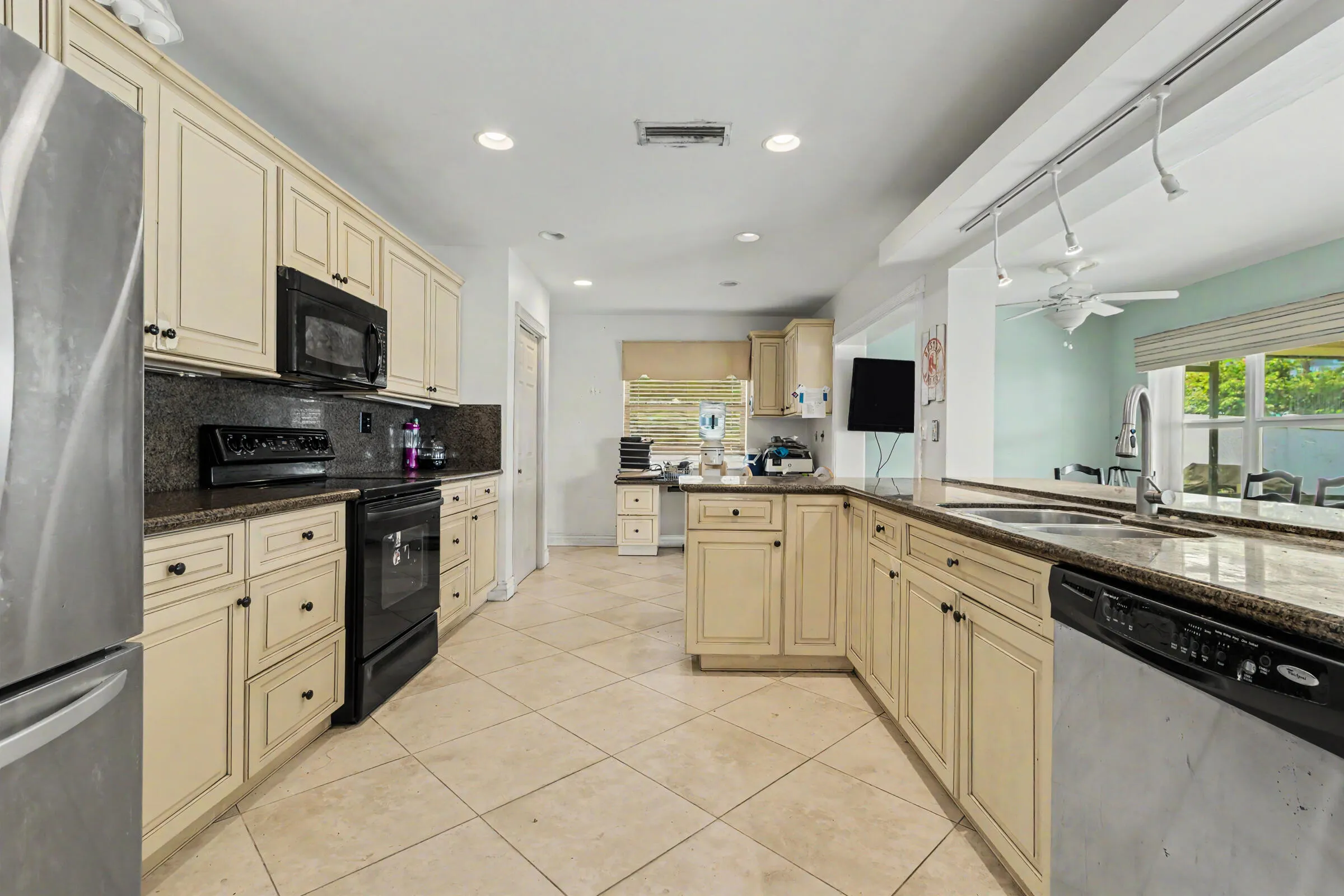 Kitchen is in the heart of the home with lots of granite counter space