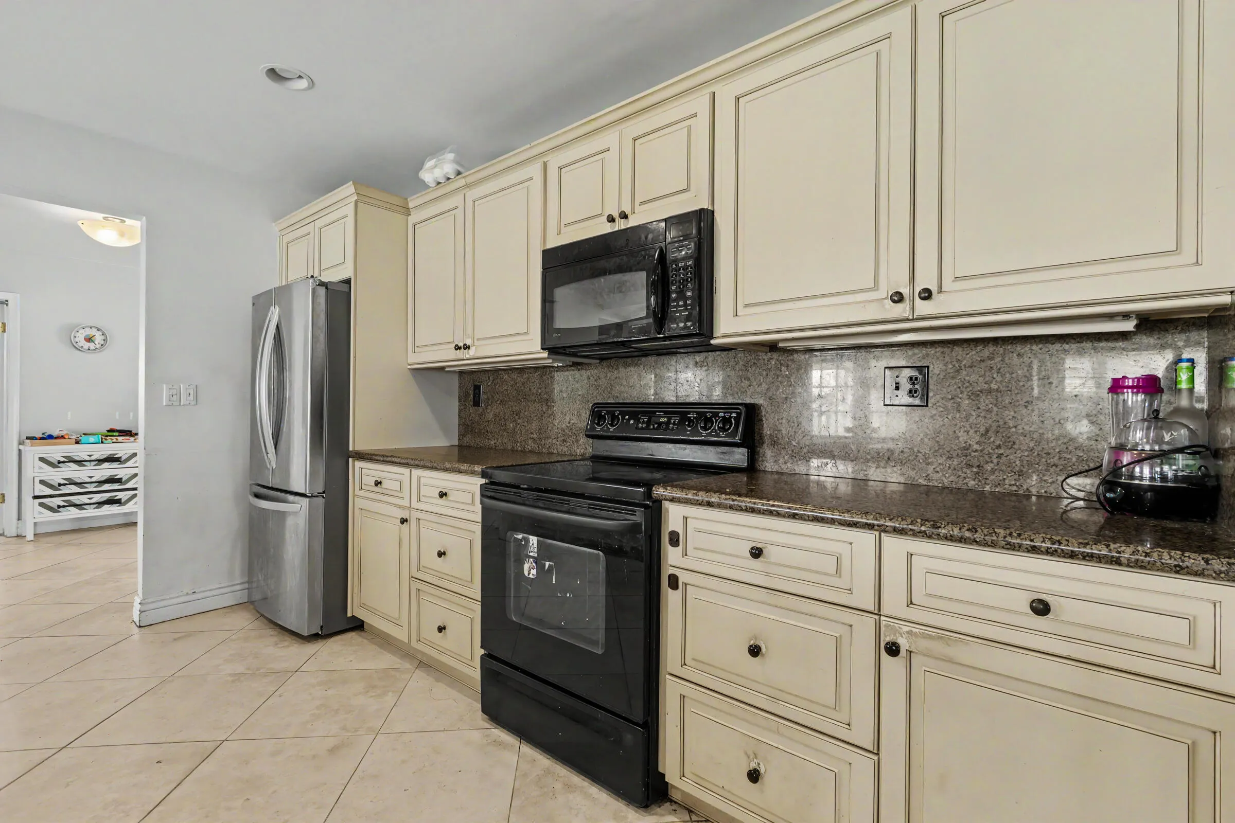 Kitchen is in the heart of the home with lots of granite counter space