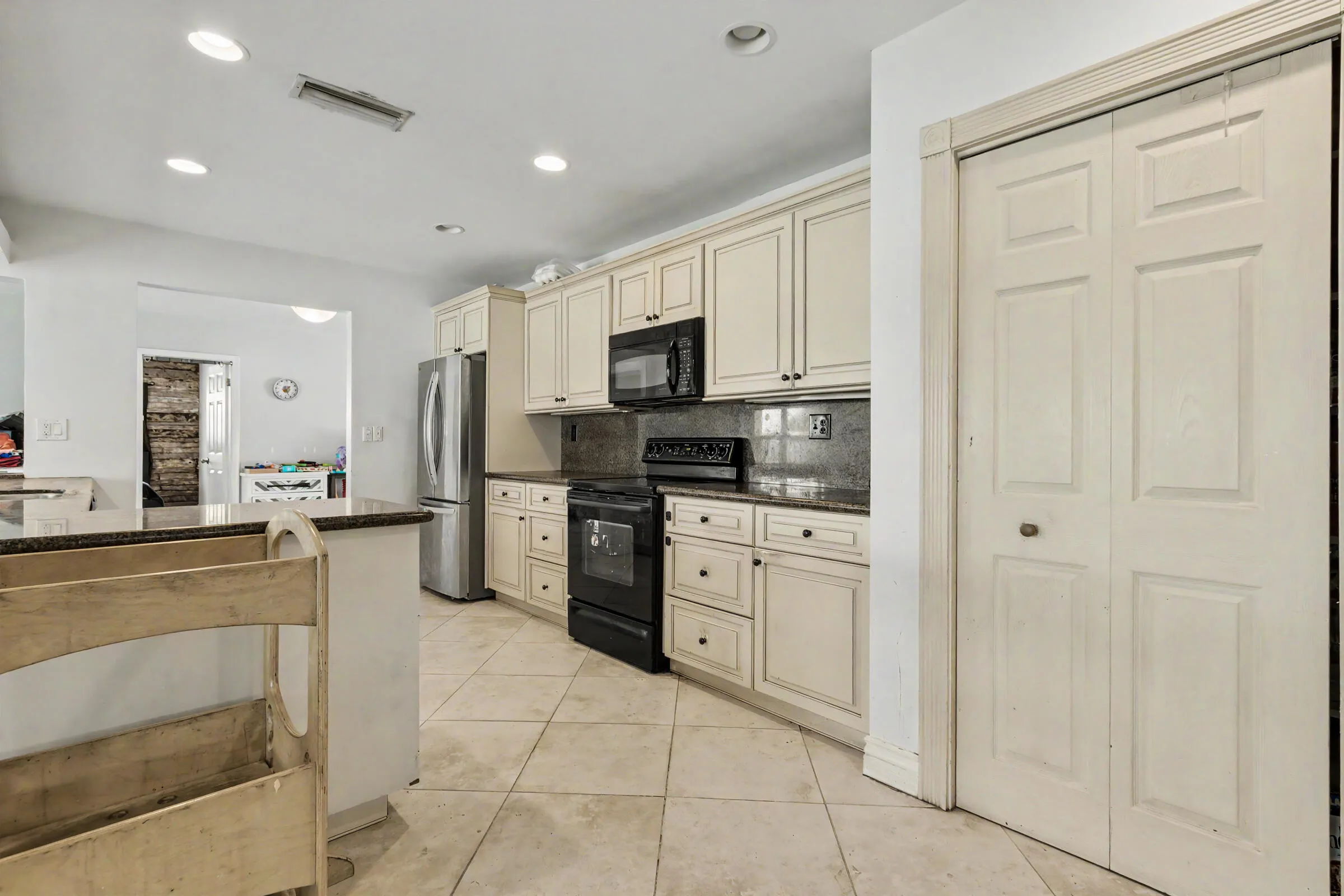Kitchen is in the heart of the home with lots of granite counter space