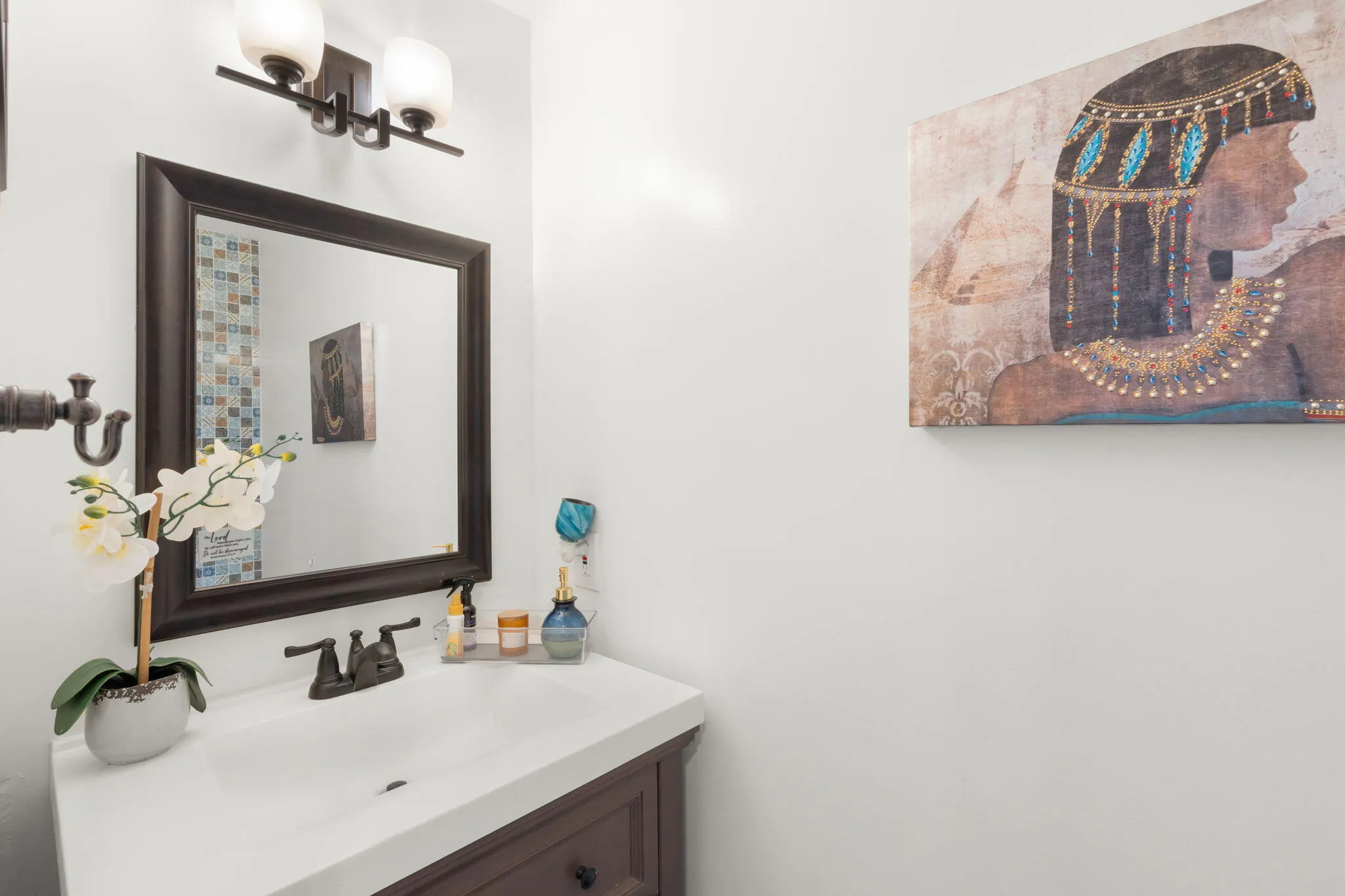 UPDATED POWDER ROOM AT ENTRY.
