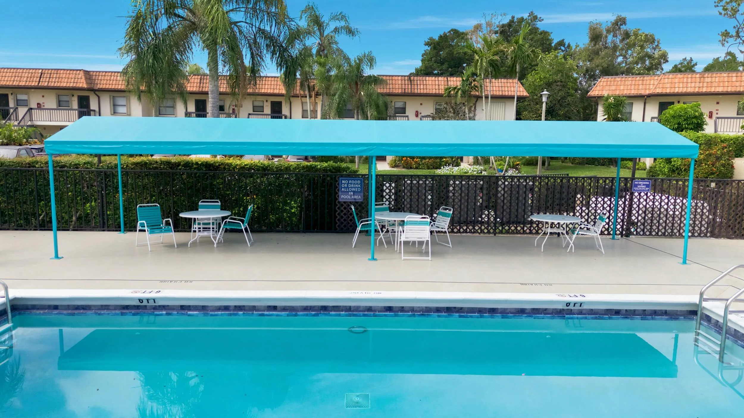 Enjoy resort-style amenities just steps from your door, including a beautifully maintained community pool, relaxing spa, spacious sun deck, and shaded seating areas. Surrounded by tropical landscaping and ample room to unwind, this inviting gathering space offers the perfect setting to soak up the South Florida lifestyle year-round.