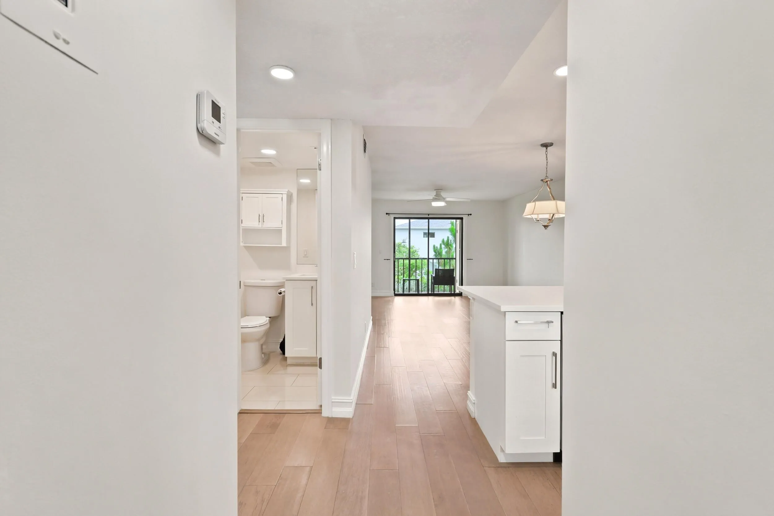 A bright and welcoming entryway sets the tone for the home, featuring updated flooring, neutral finishes, and convenient storage. The functional layout provides a seamless transition into the main living areas while creating an inviting first impression for residents and guests alike.