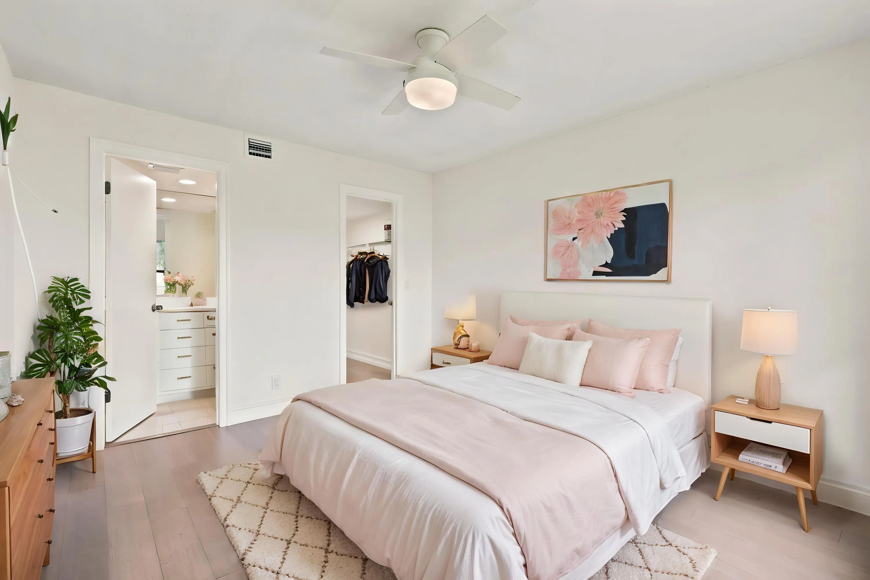 The spacious primary suite offers a peaceful retreat with updated flooring, abundant natural light, and a clean, modern aesthetic. A generous walk-in closet provides excellent storage, while the private ensuite bath adds convenience and functionality. The comfortable layout creates the perfect space to relax and unwind at the end of the day.