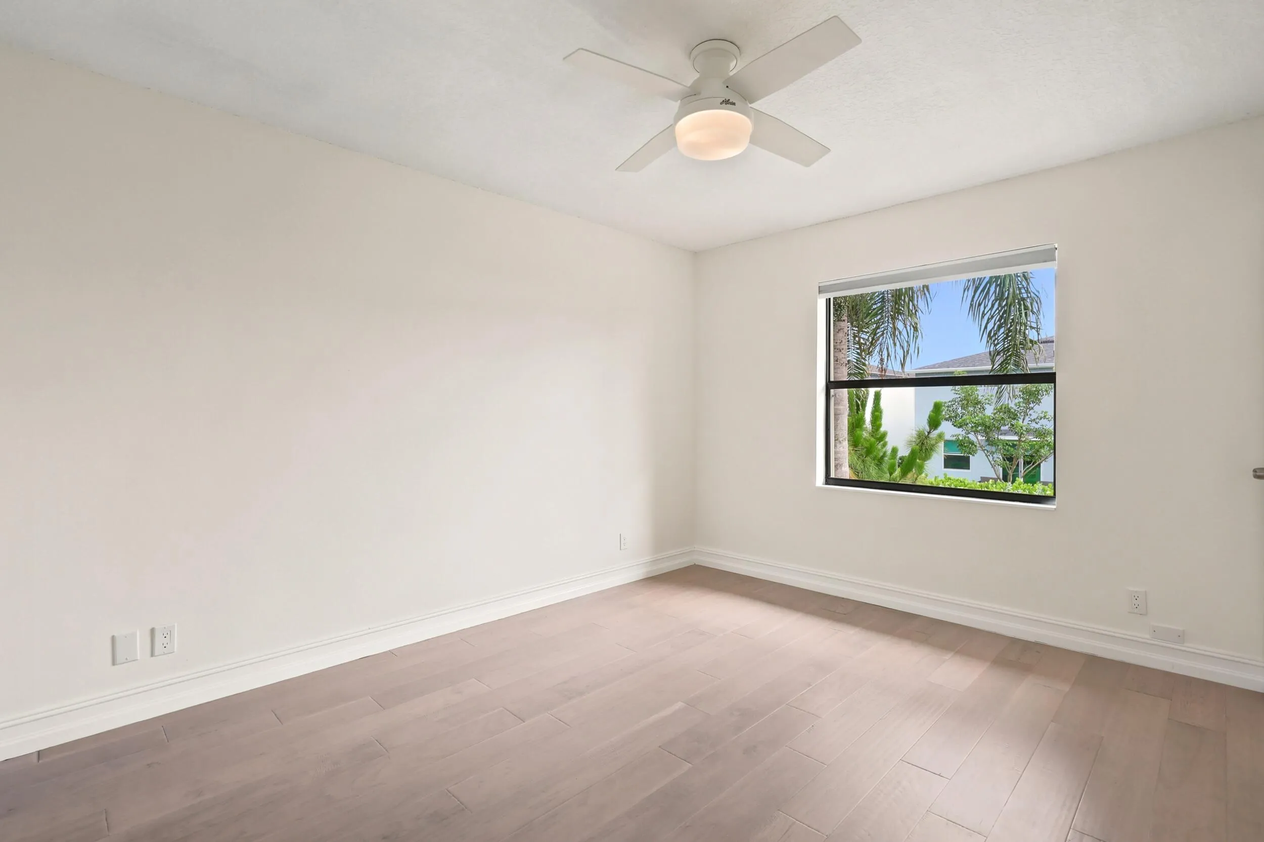 The spacious primary suite offers a peaceful retreat with updated flooring, abundant natural light, and a clean, modern aesthetic. A generous walk-in closet provides excellent storage, while the private ensuite bath adds convenience and functionality. The comfortable layout creates the perfect space to relax and unwind at the end of the day.