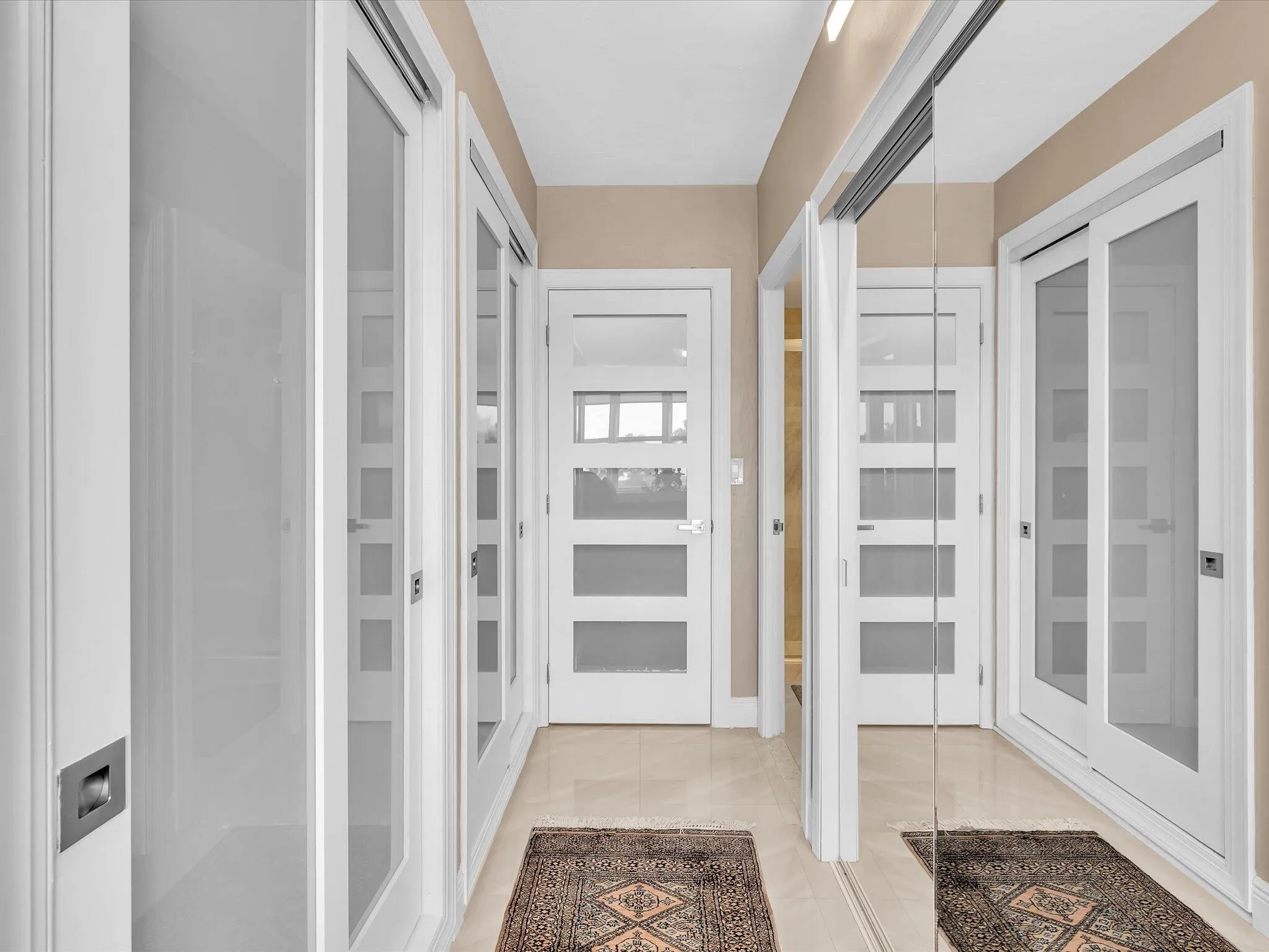 Closets flank the entry to ensuite bath