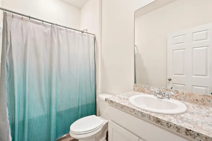 Guest bathroom located in between bedroom 2 and 3