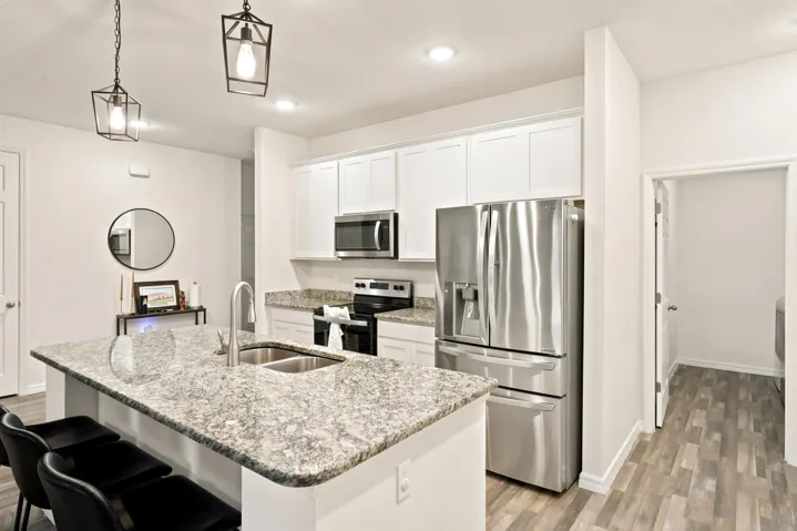 Open kitchen with spacious island and laundry off to the right