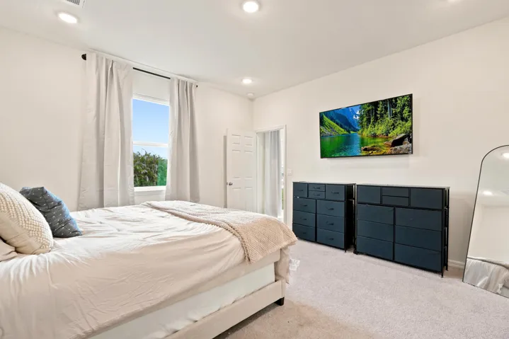Owner's spacious bedroom with attached bathroom