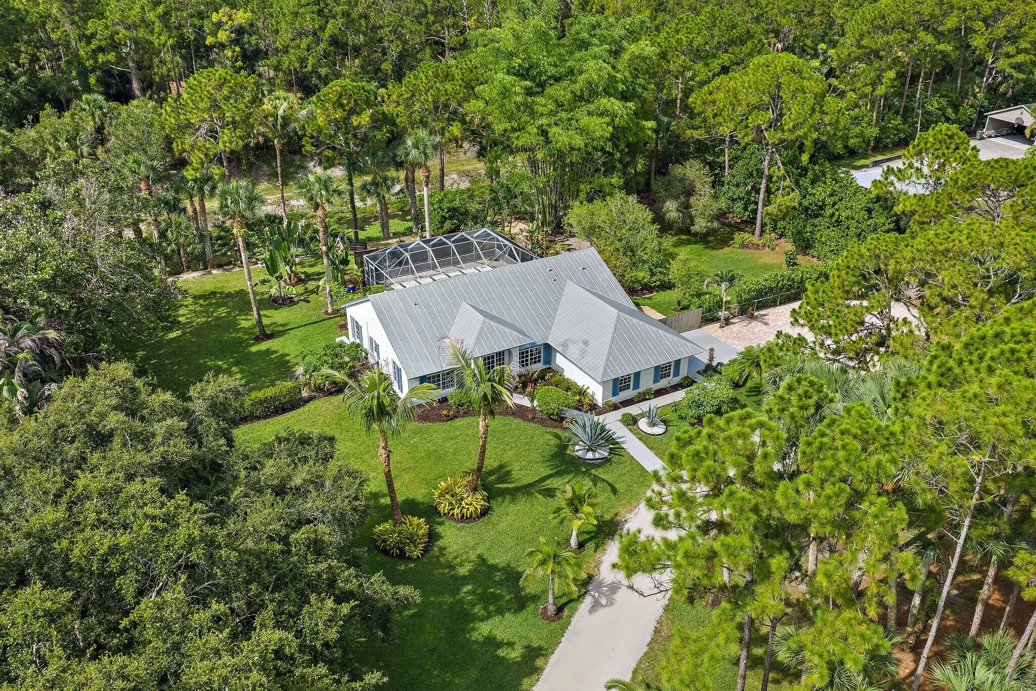 Aerial view of the home and grounds