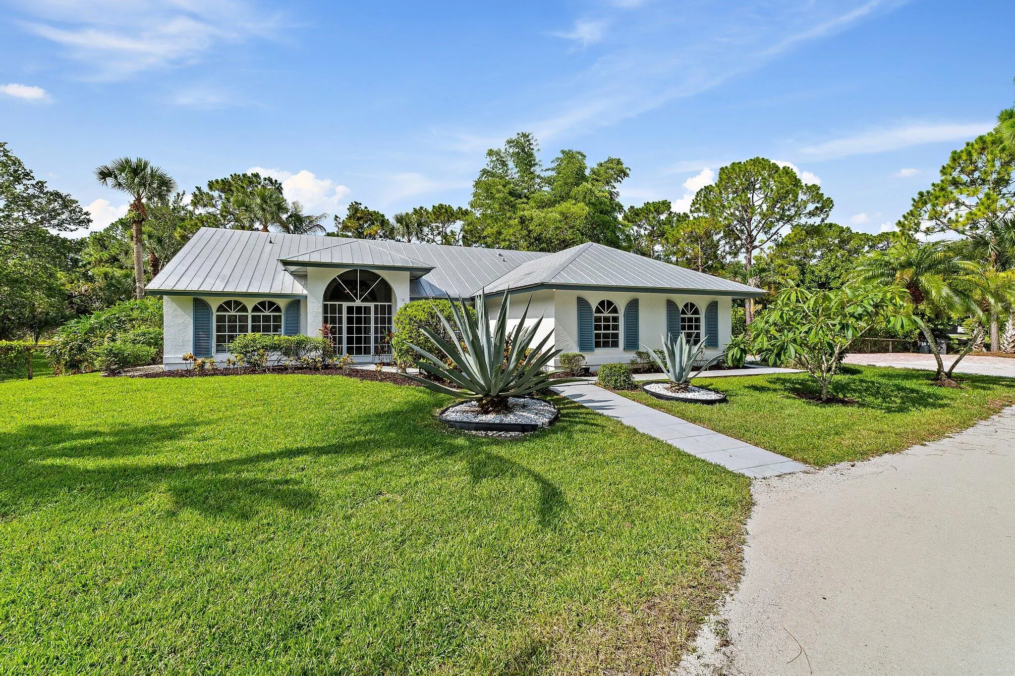 Front exterior and front lawn