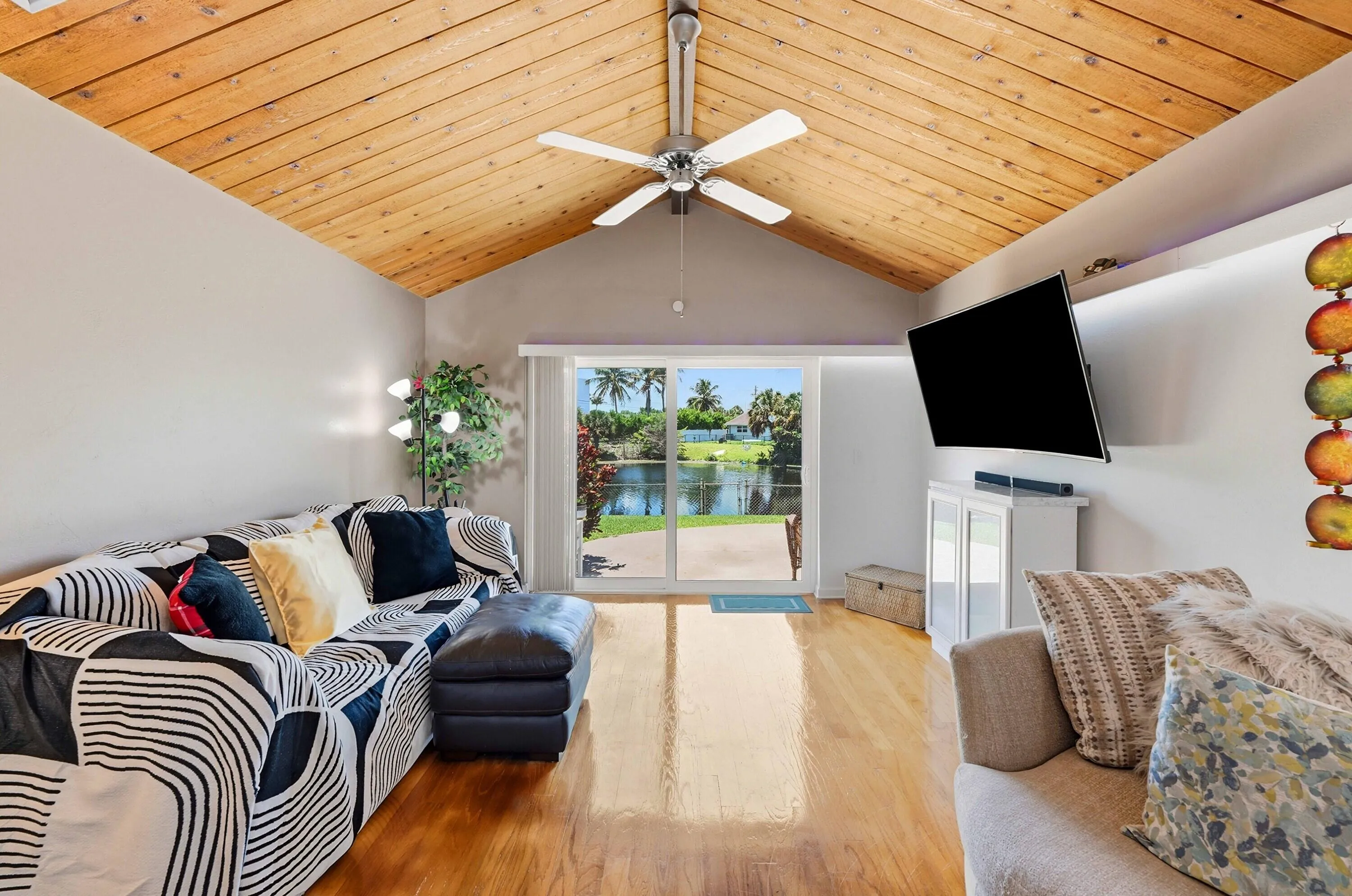 Den with expansive water views and access to patio/backyard