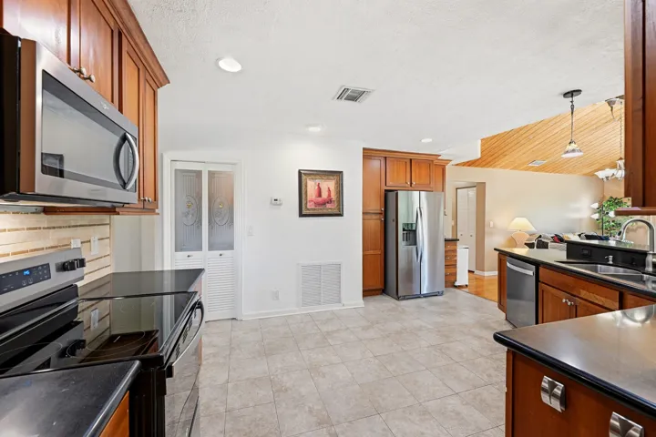 Kitchen - Cedar Cabinets, Black Granite, New SS Appliances