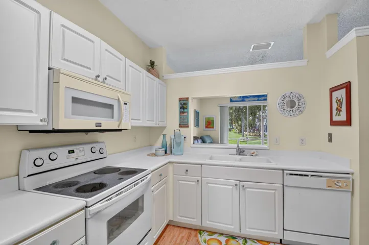 Kitchen with opening to living room