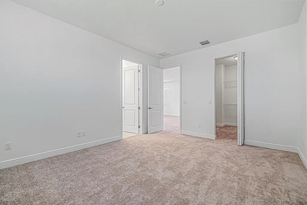 Walk in closet in primary bedroom