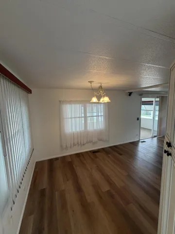 The dining area is open to the living room. and the kitchen.