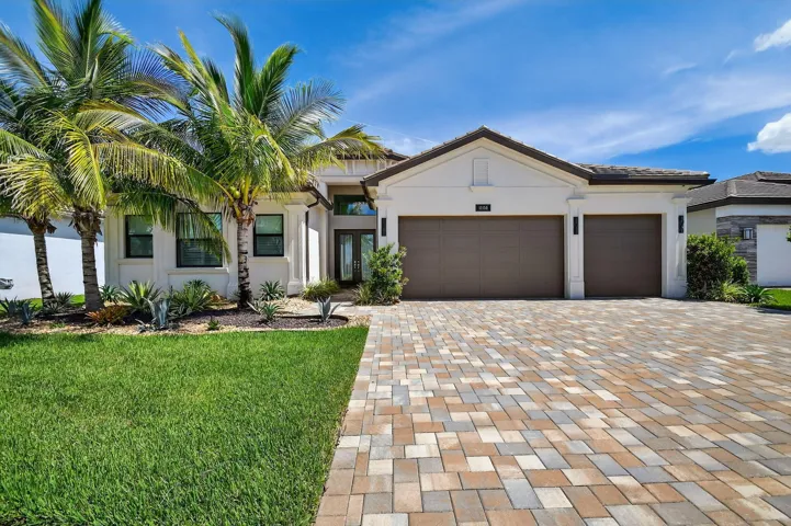 Luxurious Wide Charleston Grand House with 3 side-by-side straight entry garages and spacious driveway that fits 9 cars.