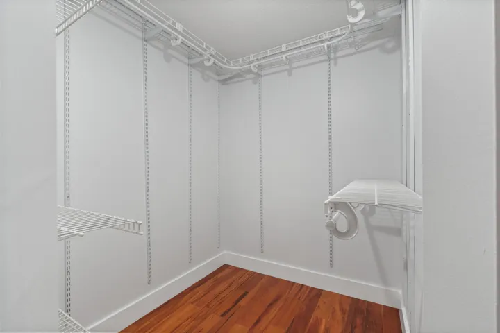 Walkin closet has shelving that you can customise.