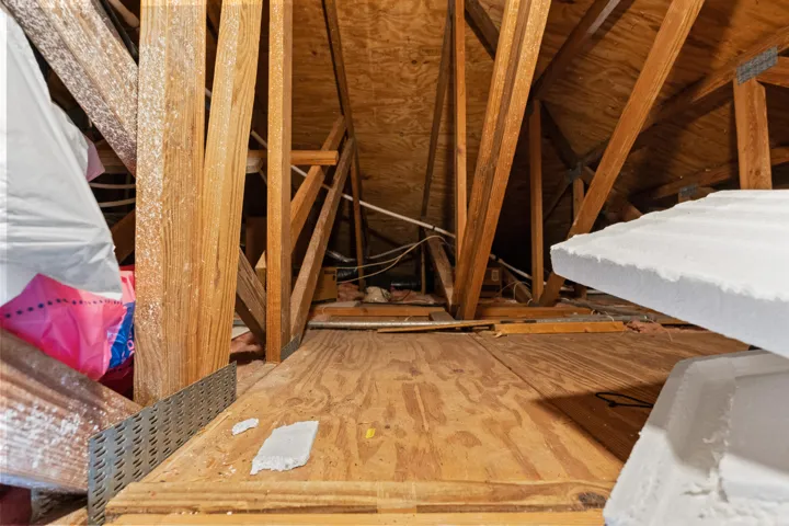 Attic has lighting and flooring for EZ storage