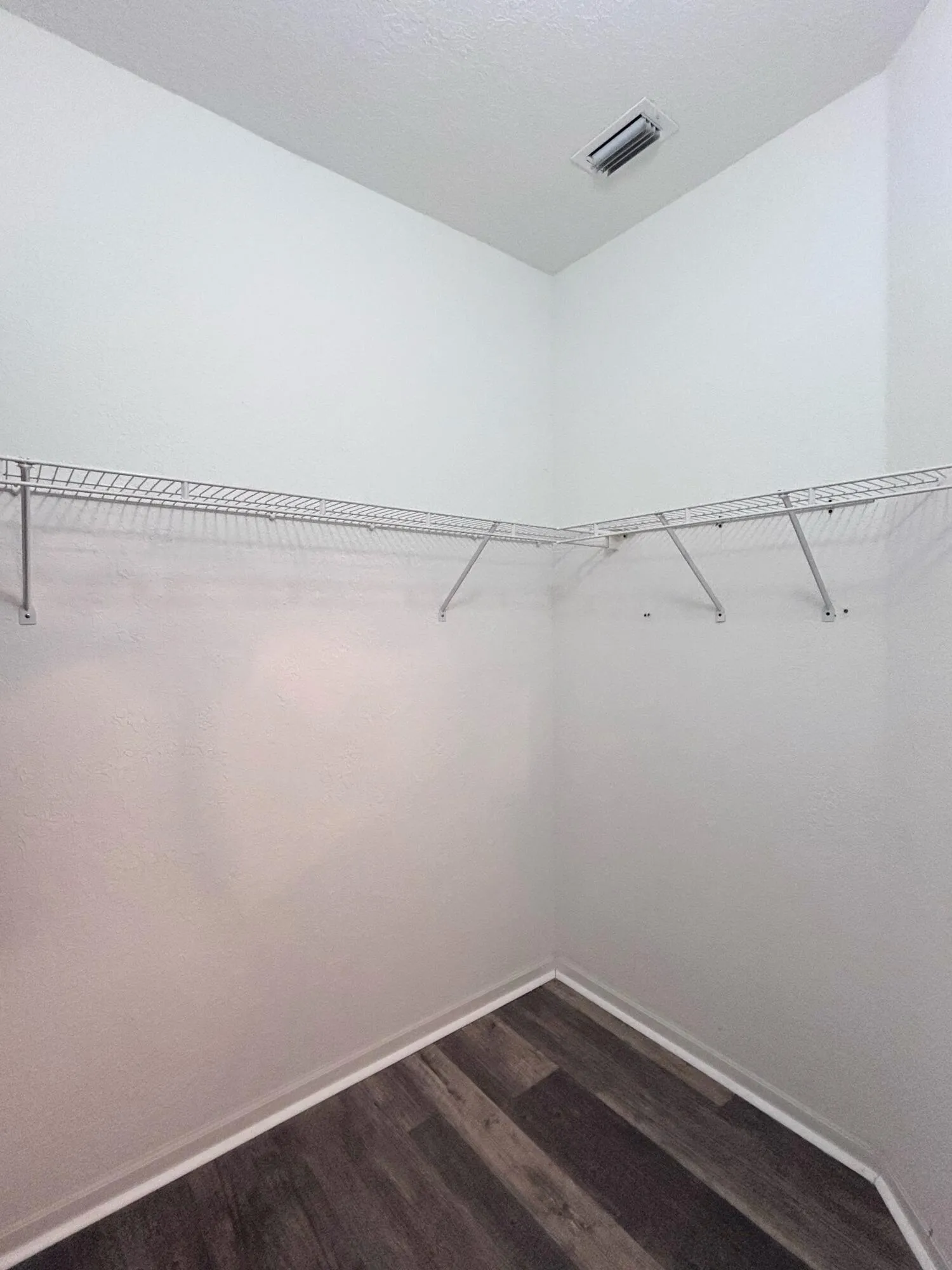 Walk-in closet in primary bedroom