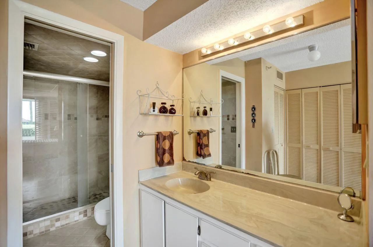 Primary bathroom with separate step in shower