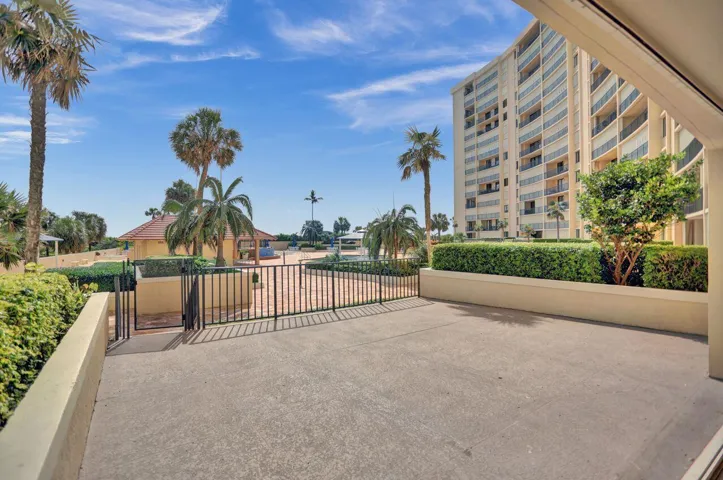 Huge open patio with a private gate to the pool deck and gas grills